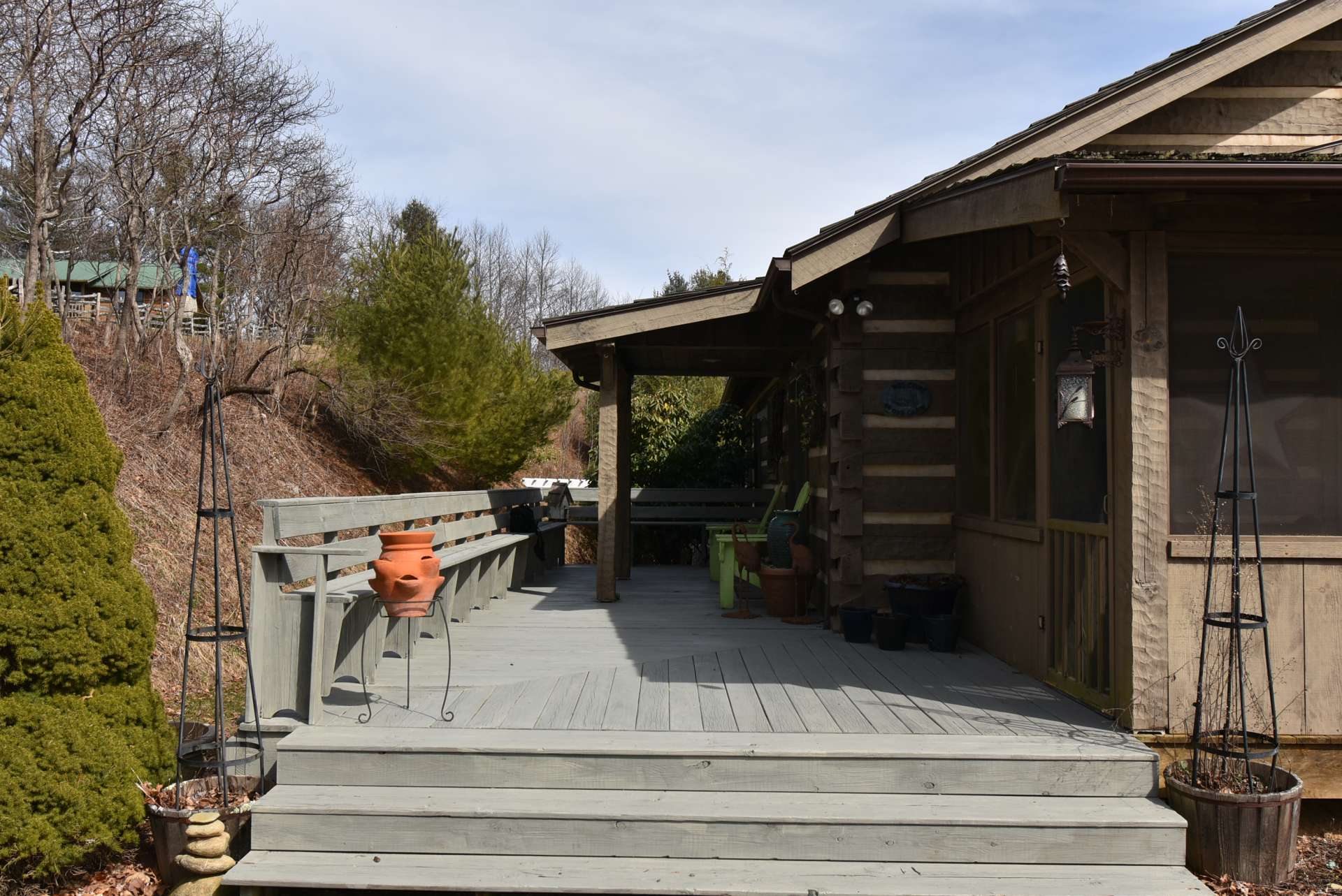 The screened porch opens to an open deck area expanding the living space during the warmer months.