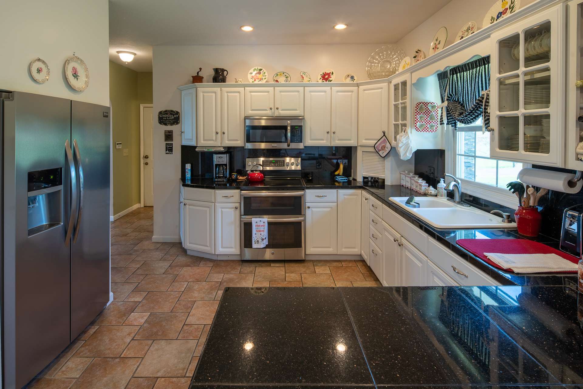 This well equipped kitchen is sure to please any chef with the stainless appliances and abundant amount of work and storage space.