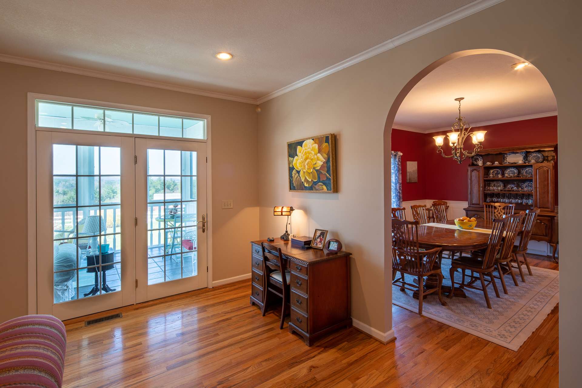 From this area of the living room you and guests can enter the formal dining room, or the screened porch for outdoor dining.