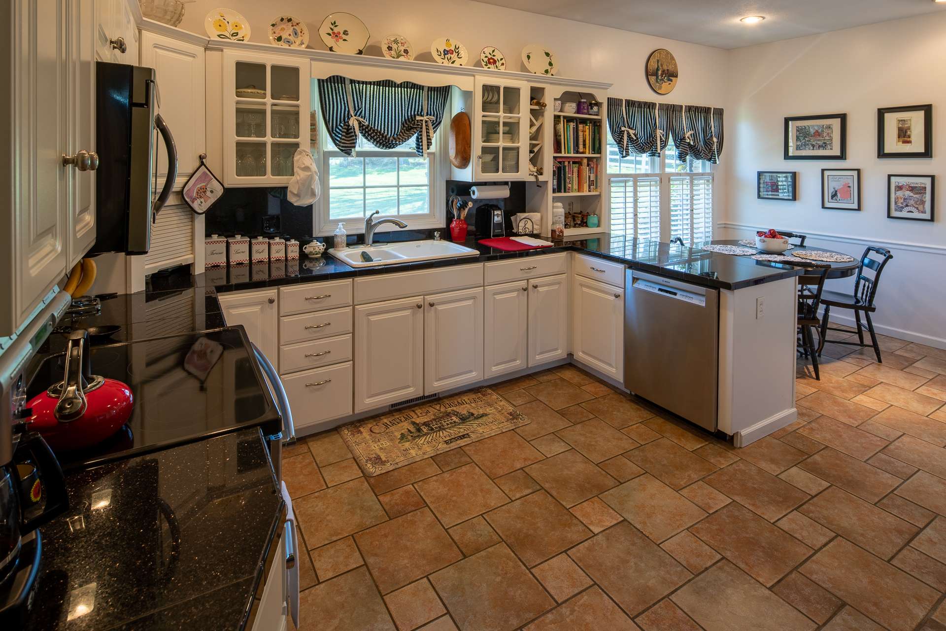 The kitchen area also offers an informal dining space.