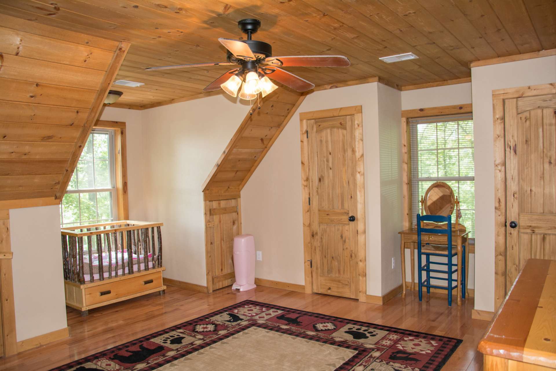 The upper level offers two guest bedrooms on either side.