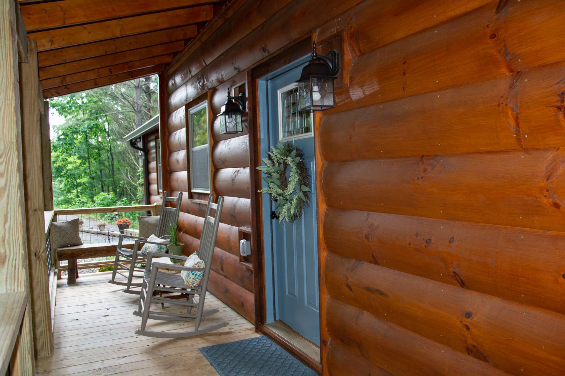 Lets go inside  this log-sided home showcasing quality craftsmanship throughout including poplar bark accents and metal roof.