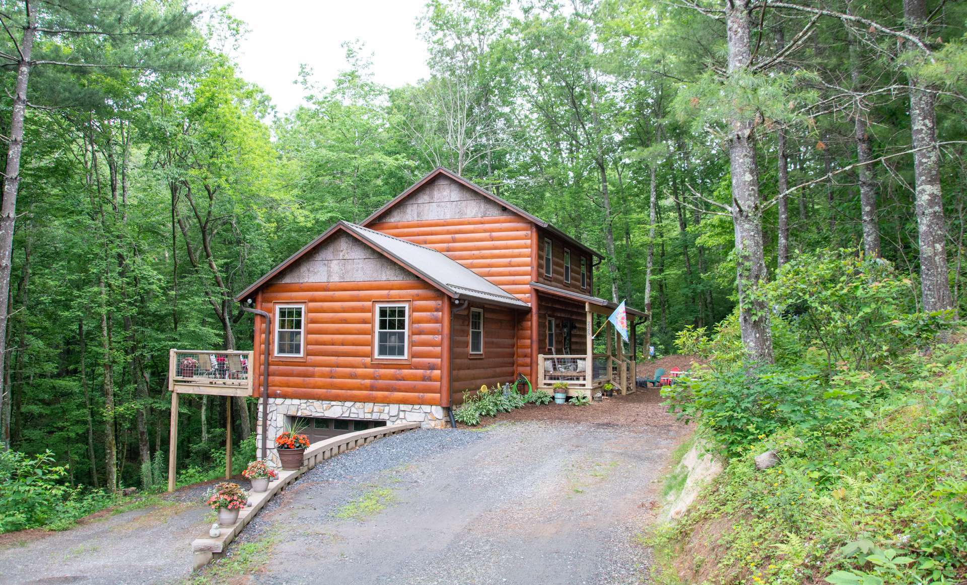 Great location in southeast Ashe County only minutes away from West Jefferson, the Blue Ridge Parkway and the New River!  This log sided cabin in a peaceful forest setting is offered at $319,000.  The ideal NC High Country mountain retreat!  E143