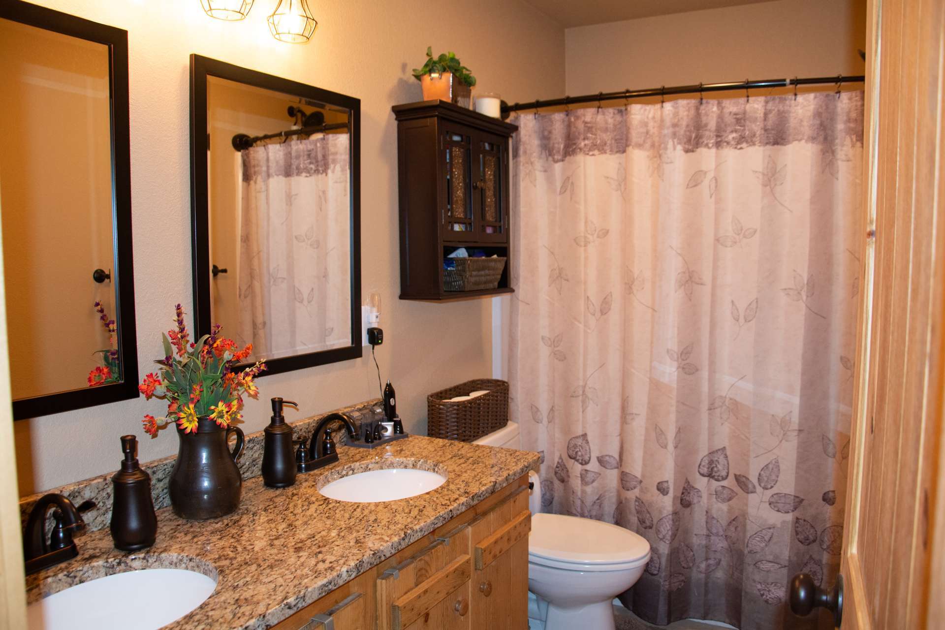 A full bath and laundry closet complete the main level.