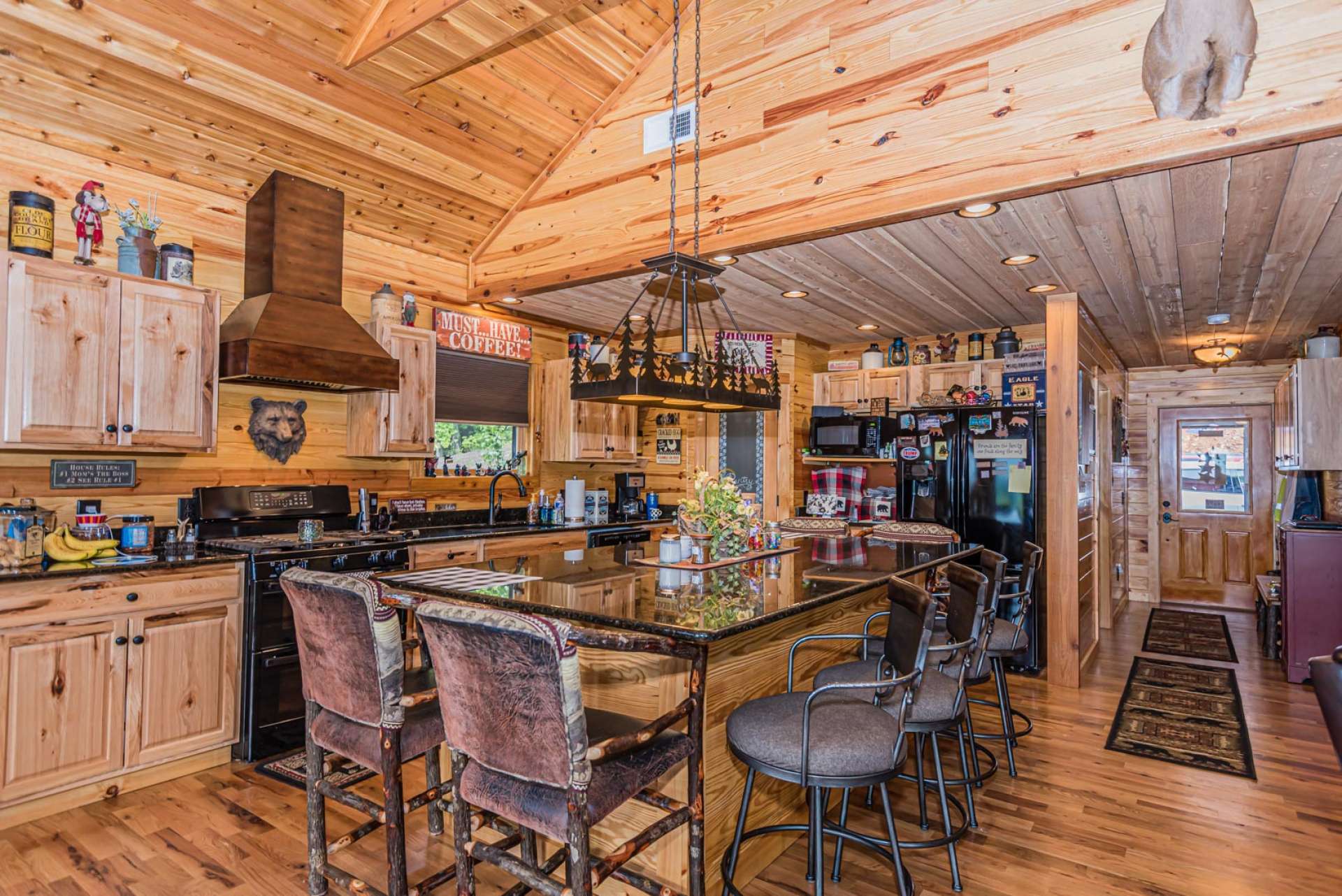 Just look at the space in the kitchen! Kitchen features include Hickory cabinets, granite, countertops, a sizable pantry, and a large custom island with granite top and seating for eight.