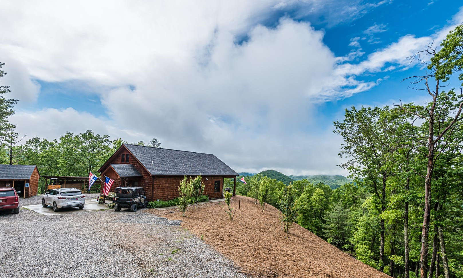 Your NC Mountain Sanctuary Awaits!  This 2-bedroom, 2-bath  cabin is privately nestled among a 2 acre setting with amazing long range mountain vista views in the Parkway Valley community in the Millers Creek area of Wilkes County.