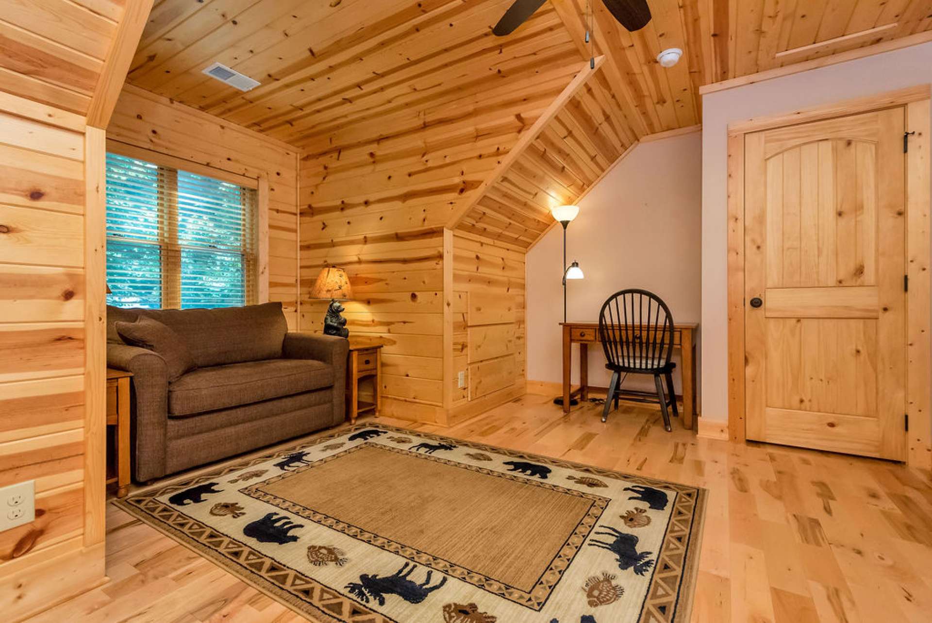 Bedroom with built-in drawers and a half closet.