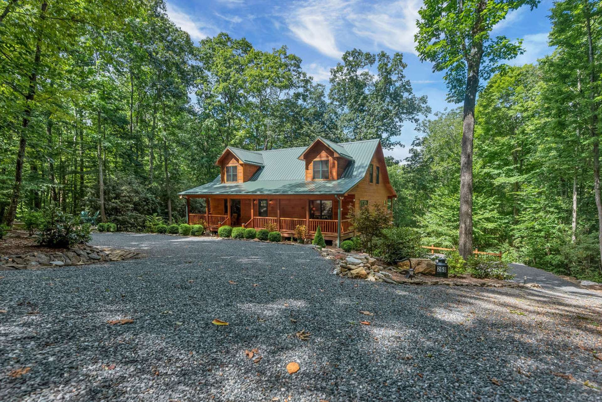 Driveway features a grid system to hold gravel in place and allow drainage.