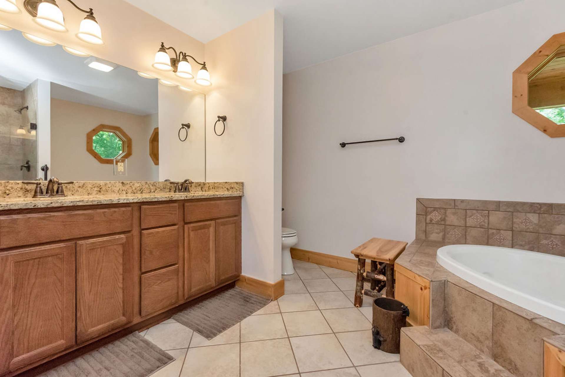 Enjoy double sinks, jetted tub, and easy step-in tile shower.