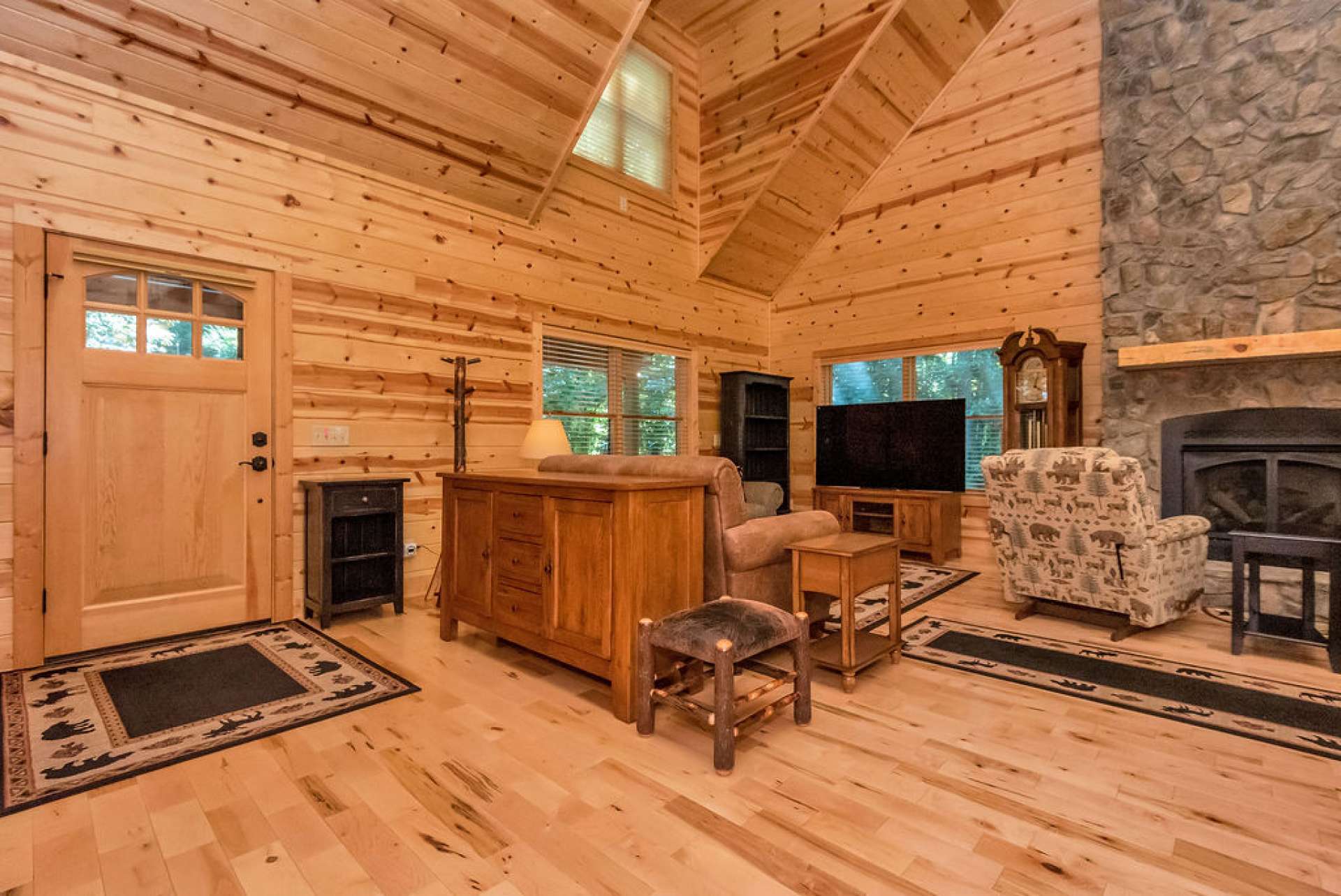 soaring ceilings and stone two story fireplace.