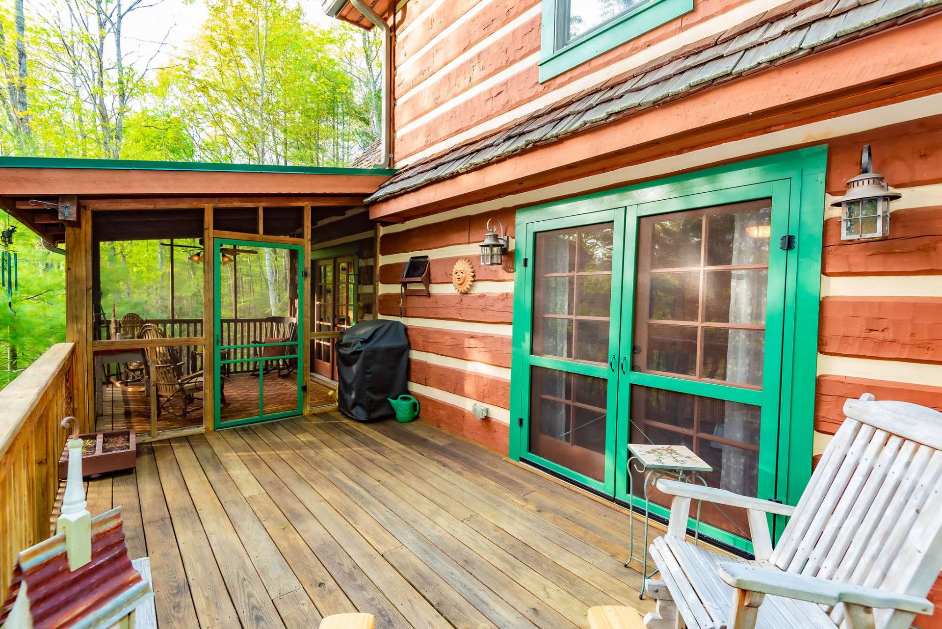 The main level offers a partially covered deck with screened area.