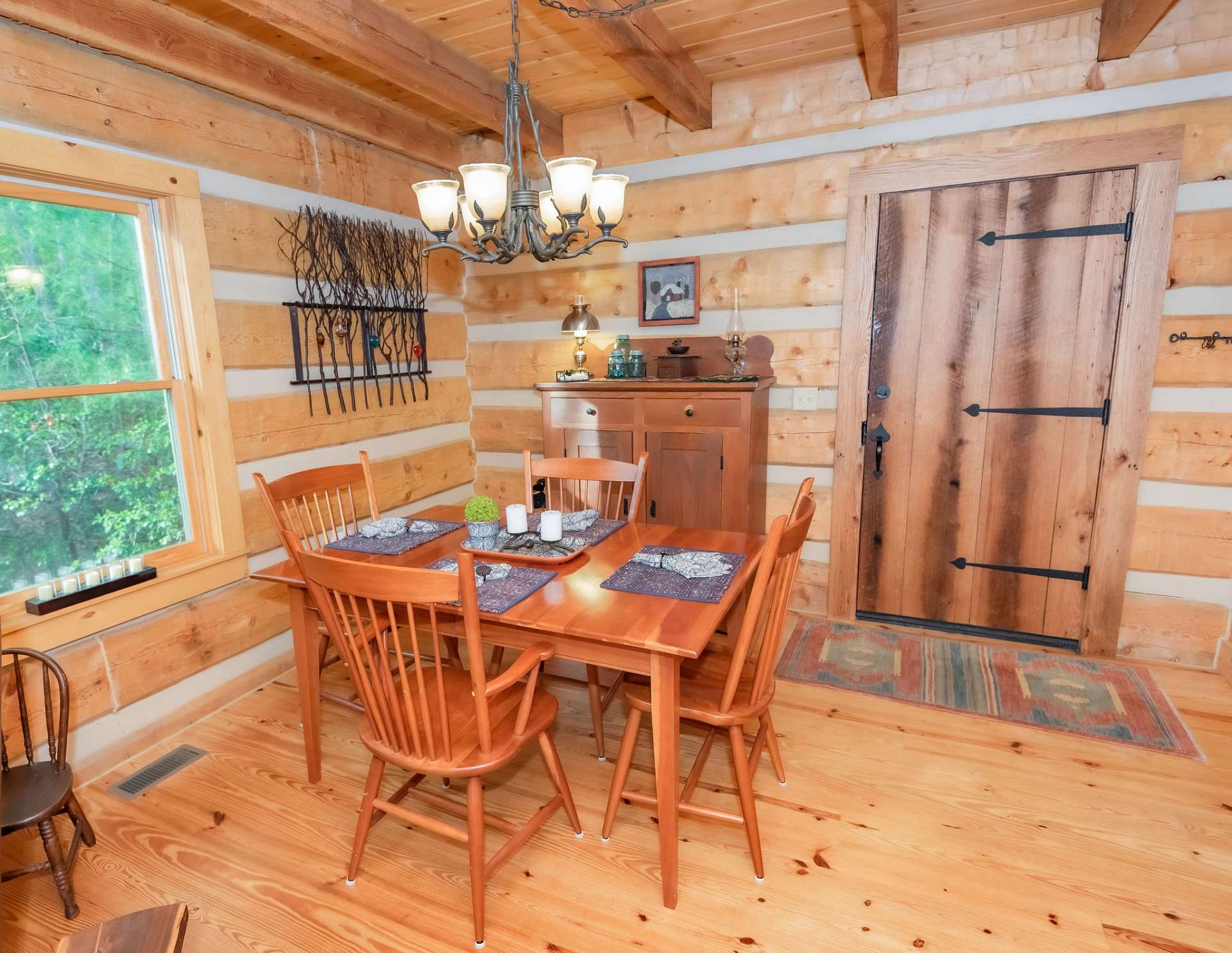 Notice the many unique details including exposed beams and the hardware accents on this door.