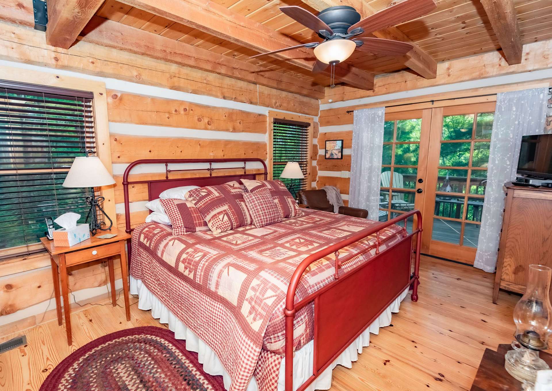 A spacious master suite is conveniently located on the main level and features a private bath, and private access to the deck.