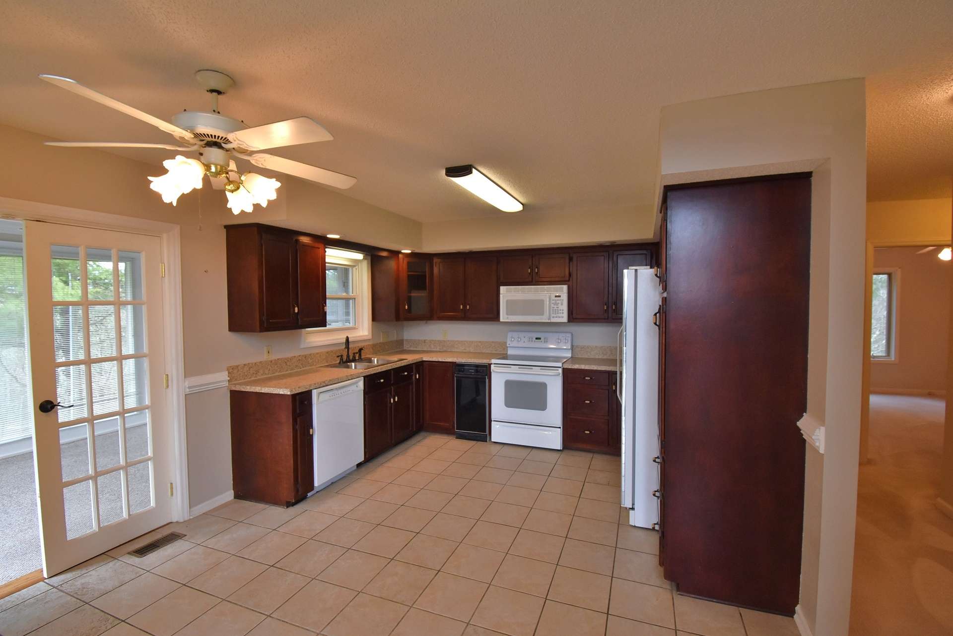 The kitchen is open to the dining area and offers easy access to the sunroom.