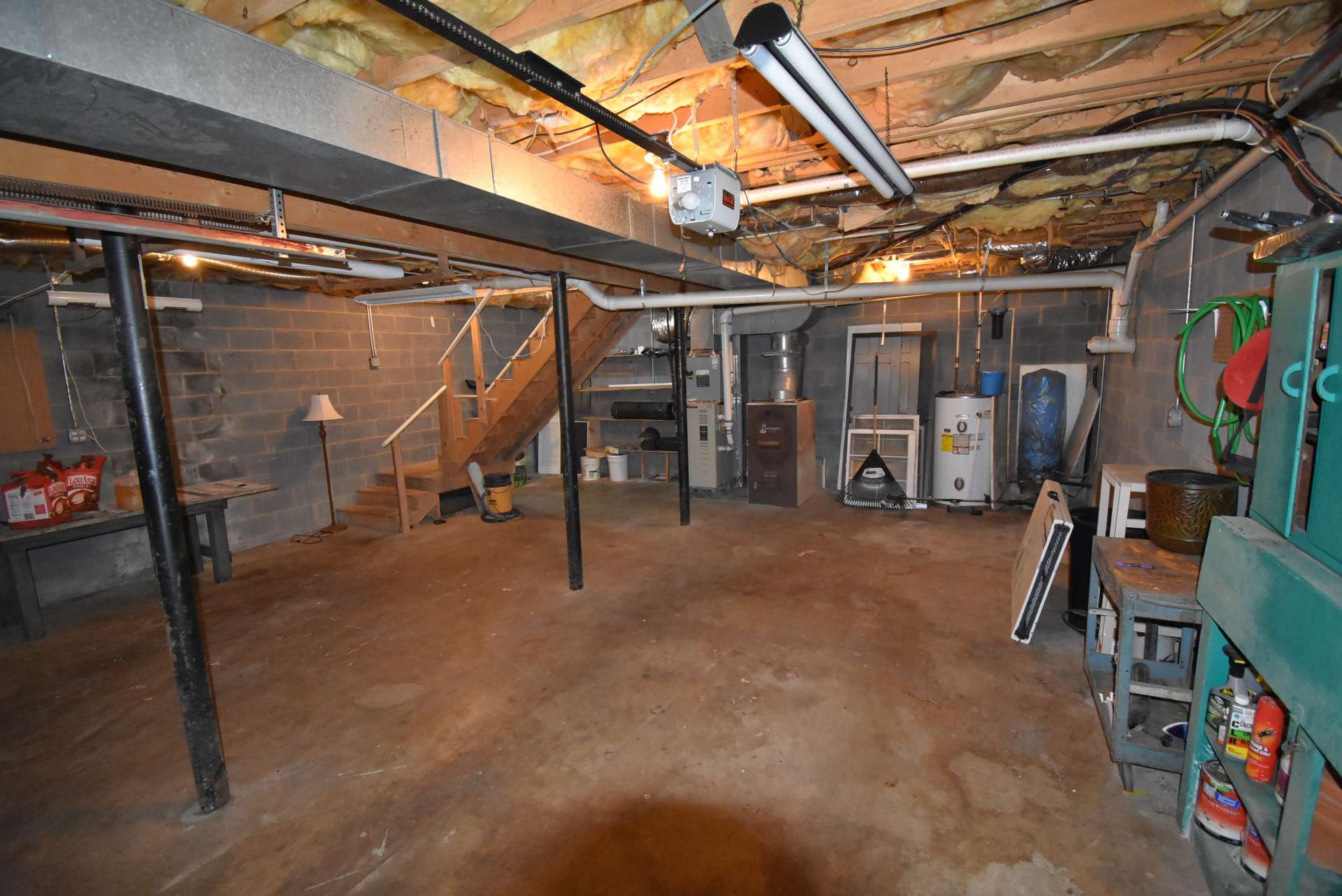 A full walk-out lower level offers lots of storage space, workshop area, garage and expansion potential.