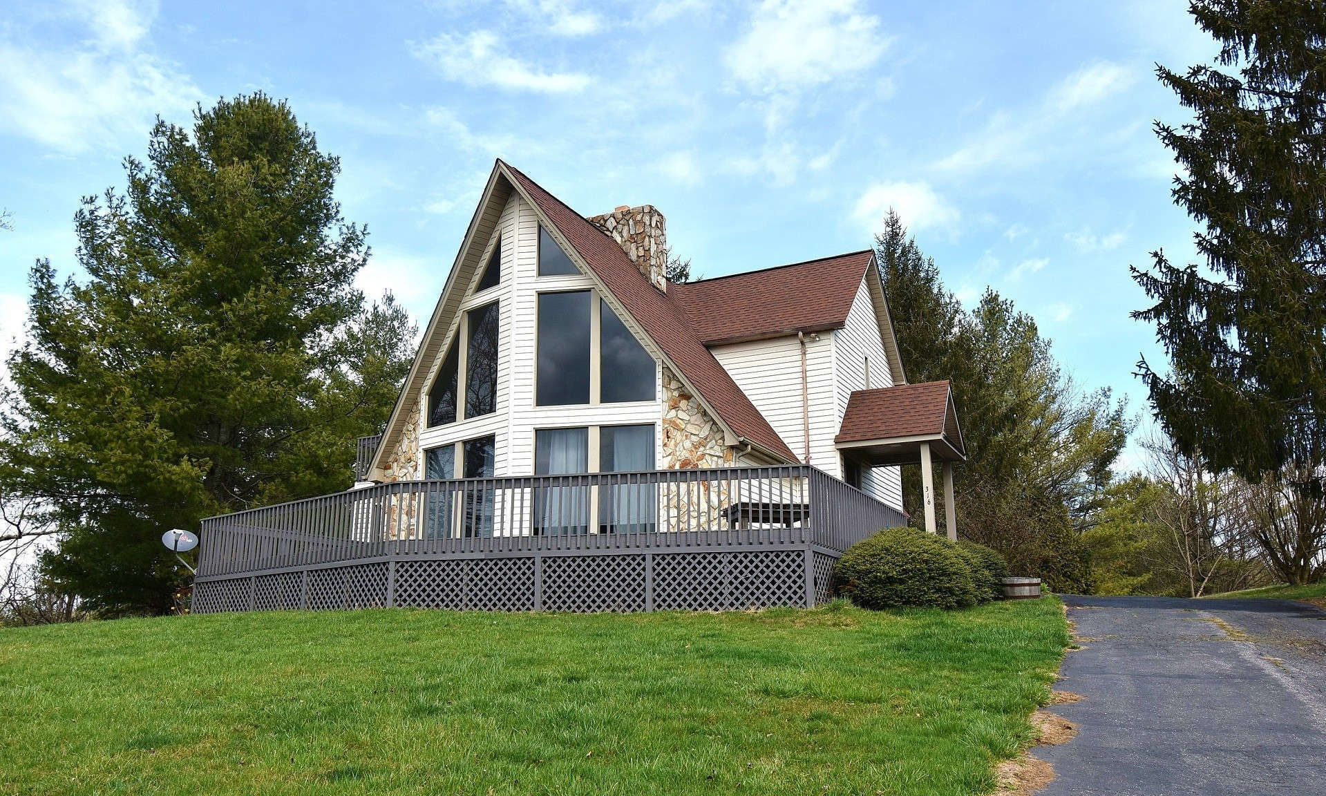 Enjoy the beauty of the country in city style comfort in this 3-bedroom, 2-bath NC Mountain Chalet retreat just a short drive from town.