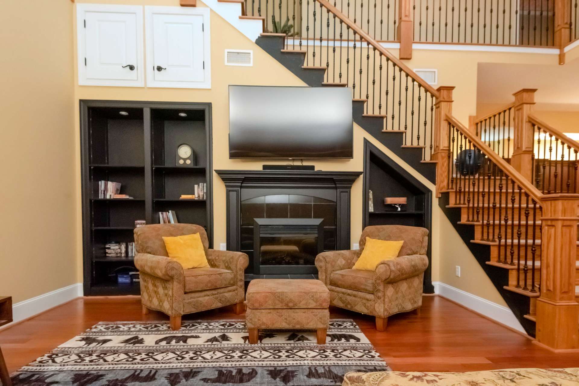 Classy living room with tile electric fireplace.