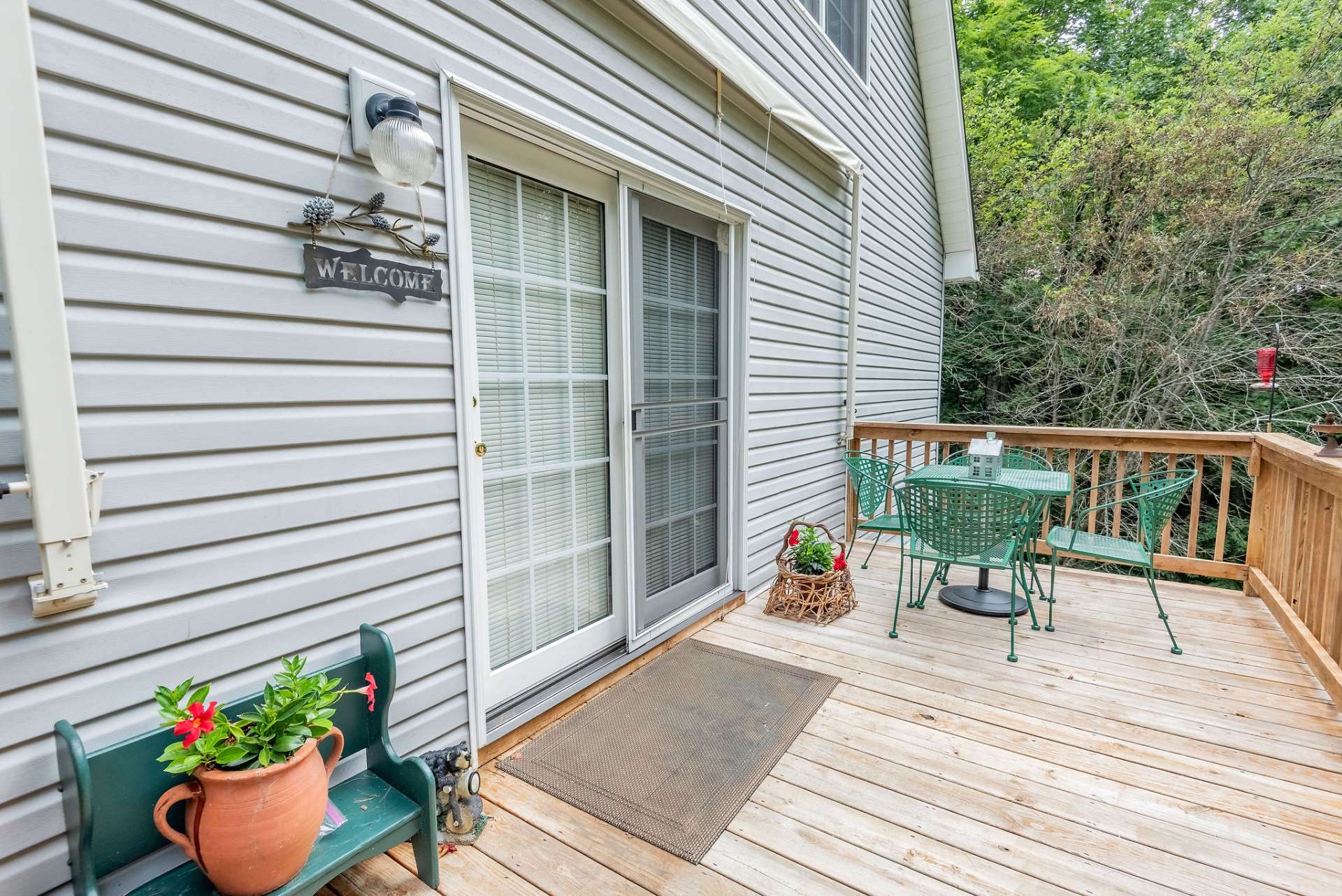 French doors lead from the deck into the main floor living and dining areas