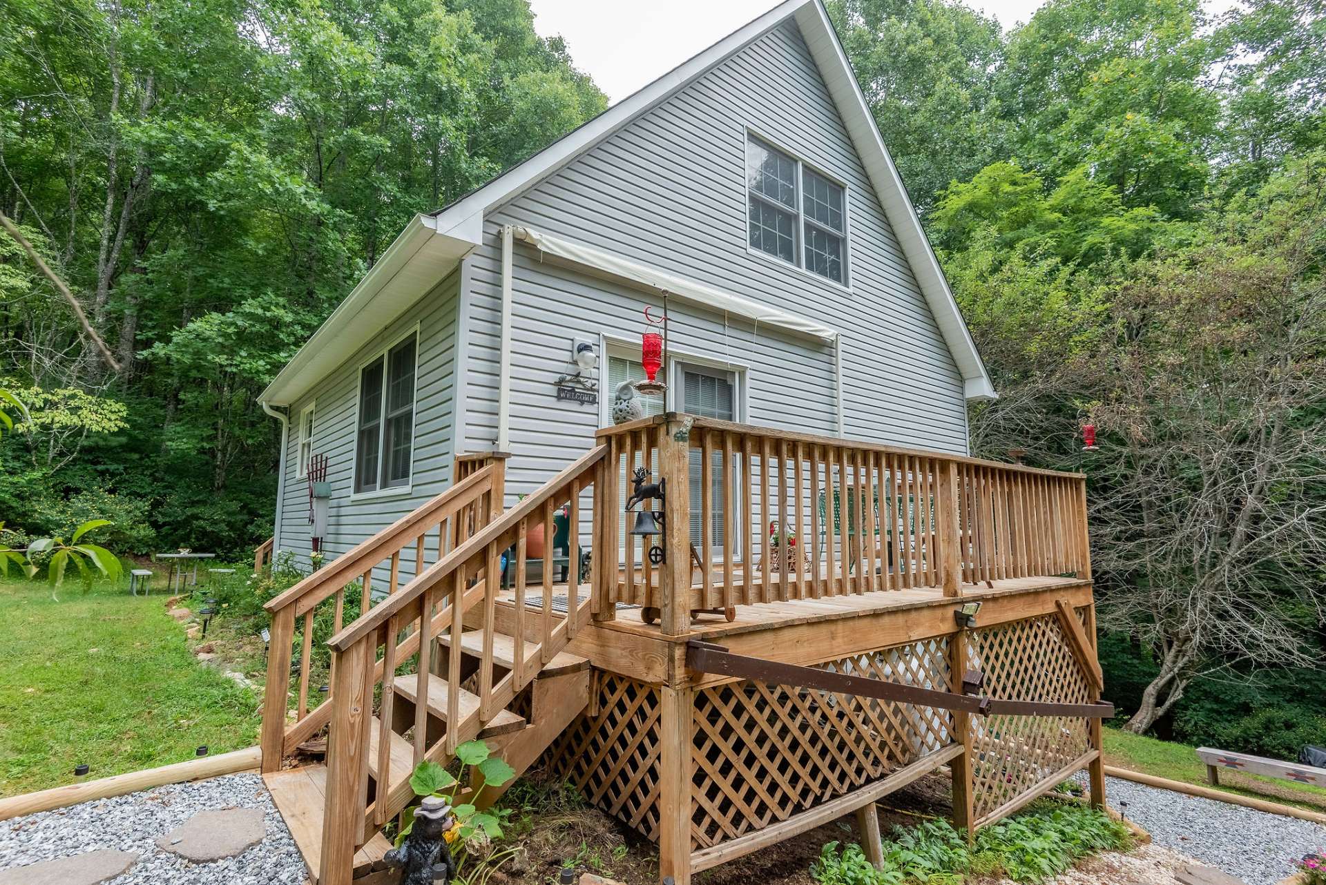 Imagine watching the stars or entertaining family or friends on the large deck overlooking the beautiful yard.