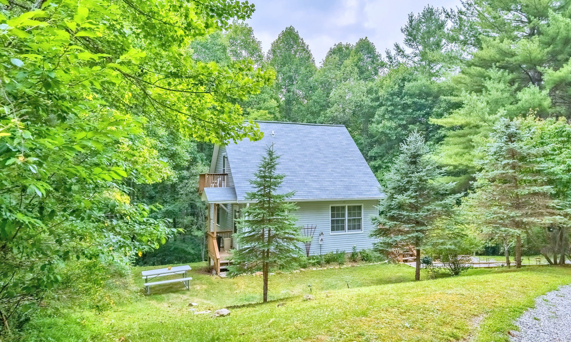 This adorable cottage is tucked back in the woods off of Moon Ridge Road in the Crumpler area of Ashe County in the NC Mountains.