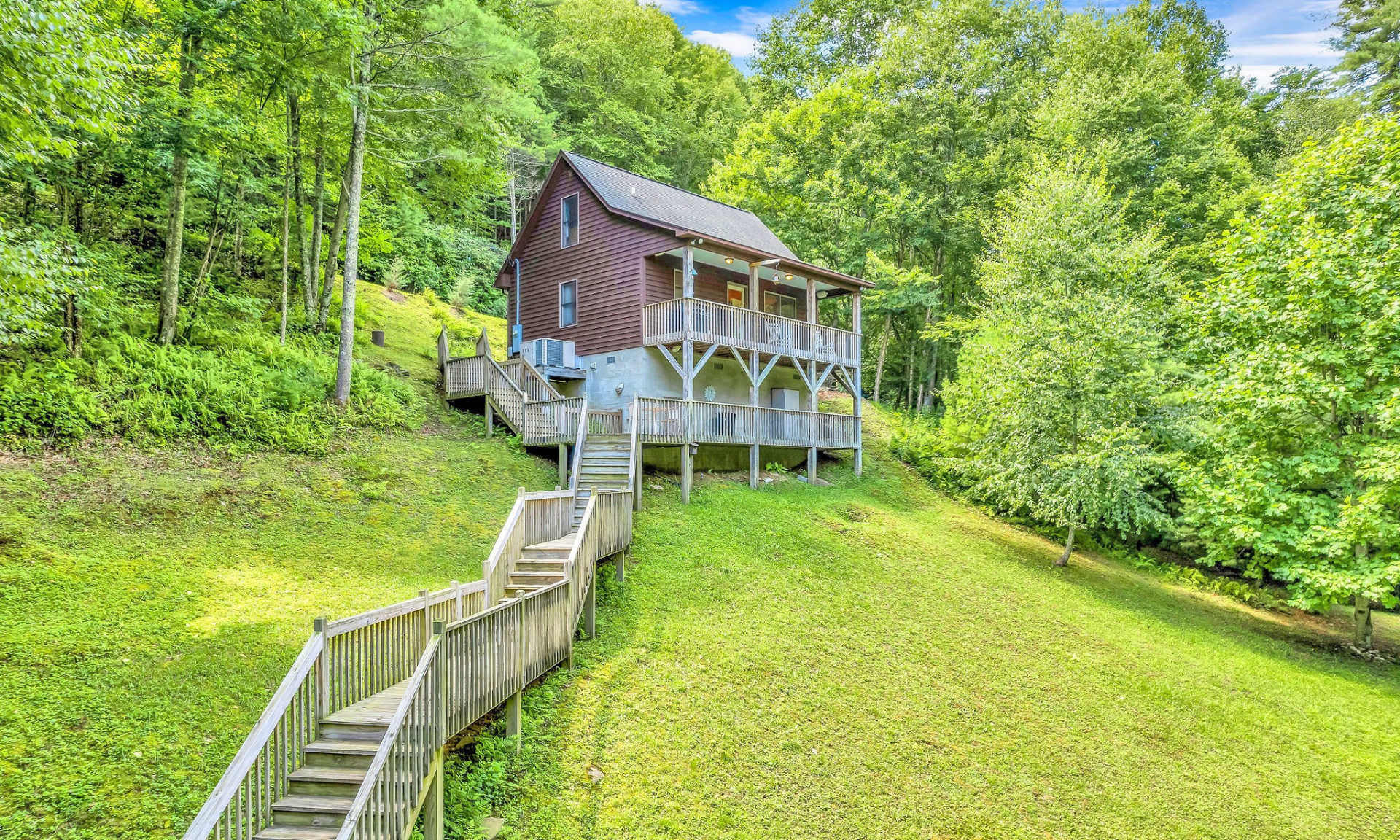 Mountain cottage nestled in the woods.