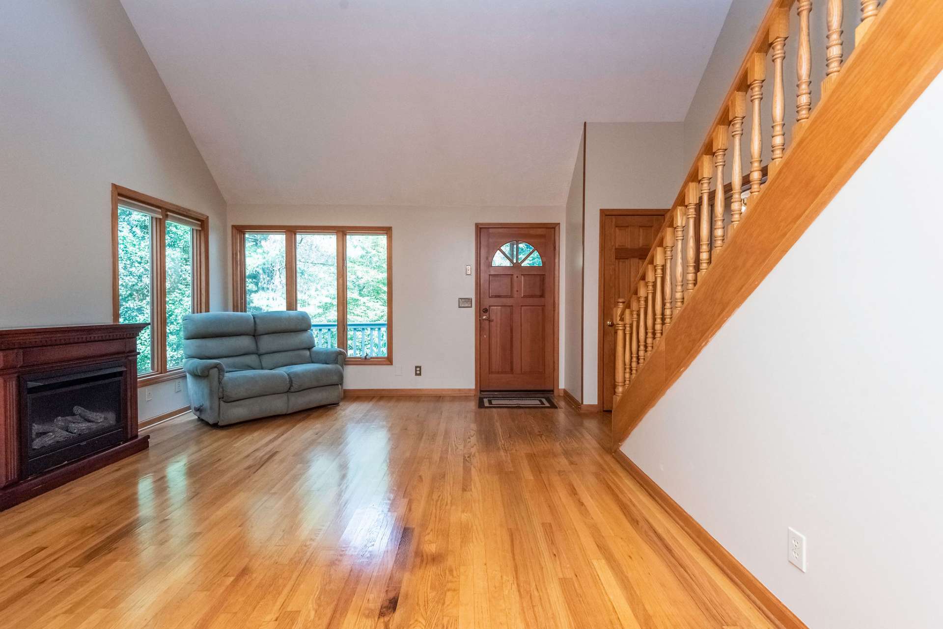 Nice bright and airy living room, waiting for you to decorate. One set of windows was added by sellers to bring in more light.