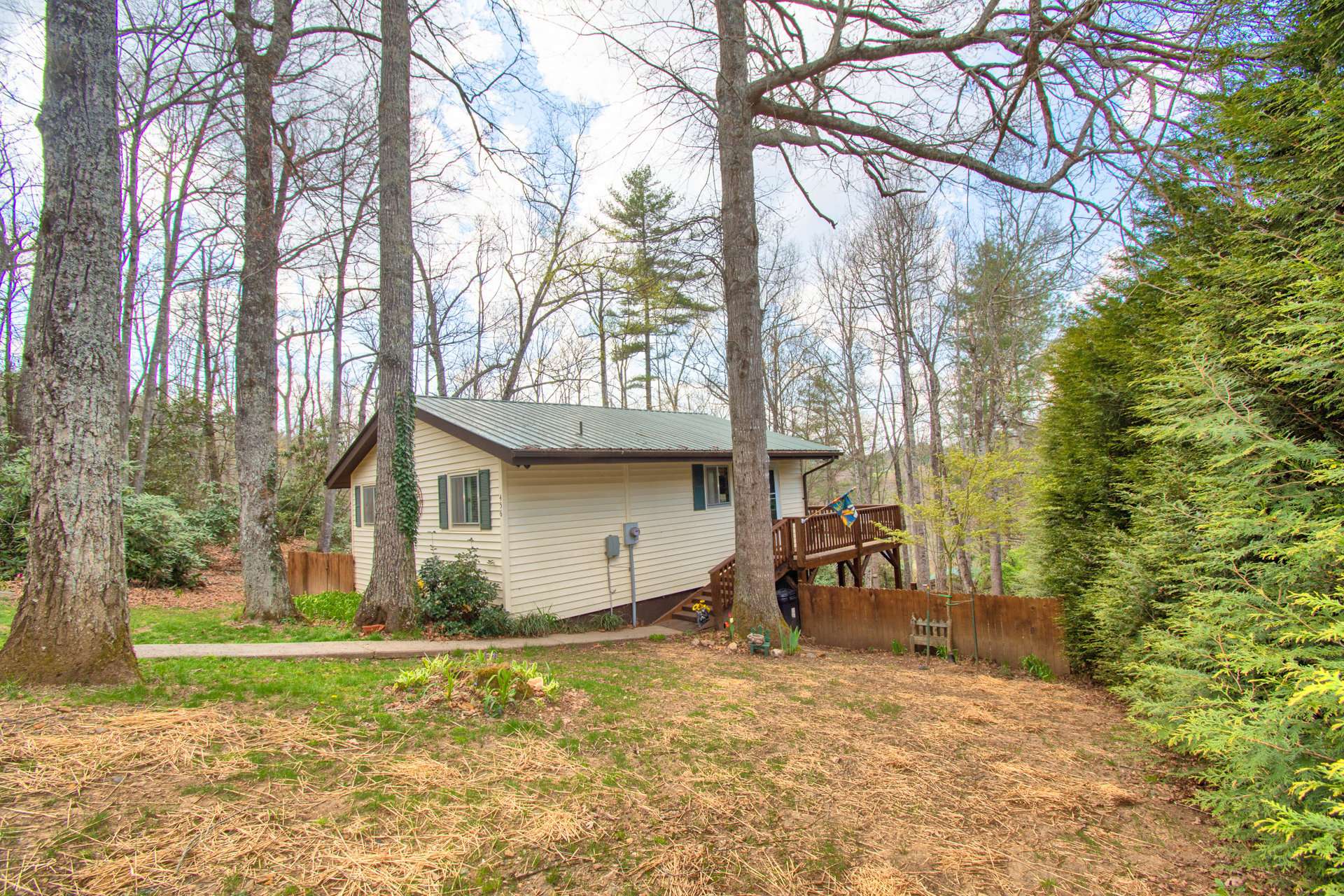 This sweet 1-bedroom, 1-bath mountain cottage nestled in a wooded setting has a successful vacation rental history.