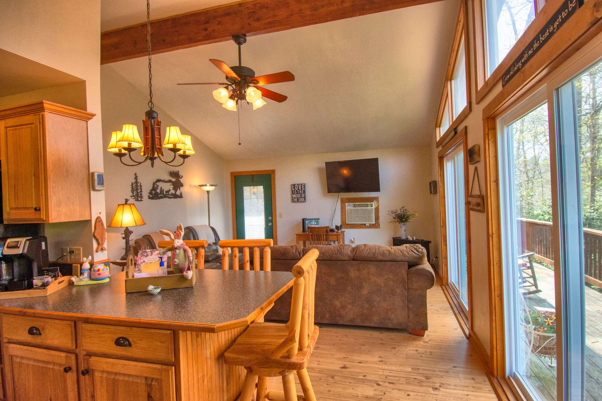 With the living area open to the kitchen and dining areas, the host or hostess will enjoy engaging in conversation while preparing meals.