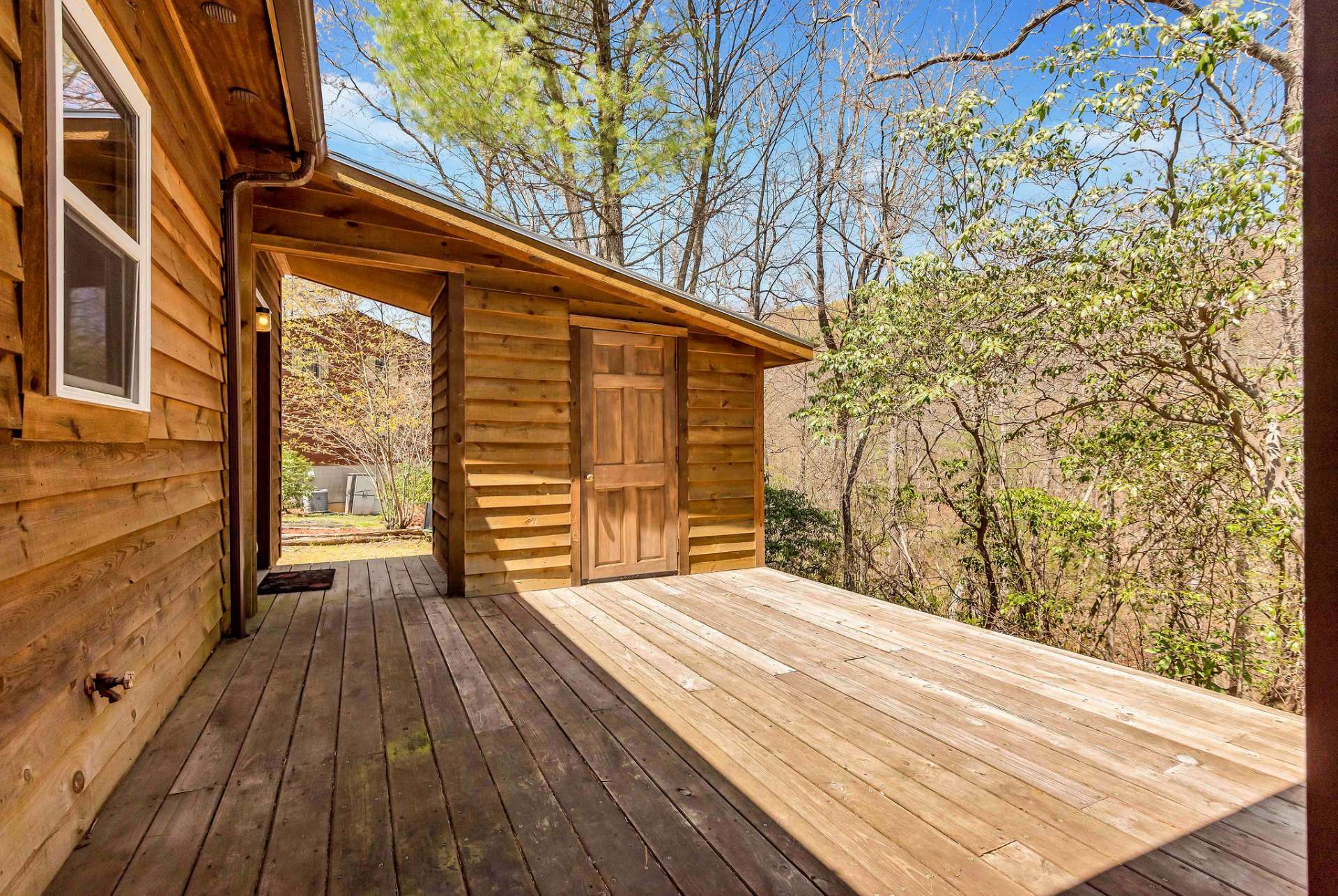 There's a small storage room off of the back deck.