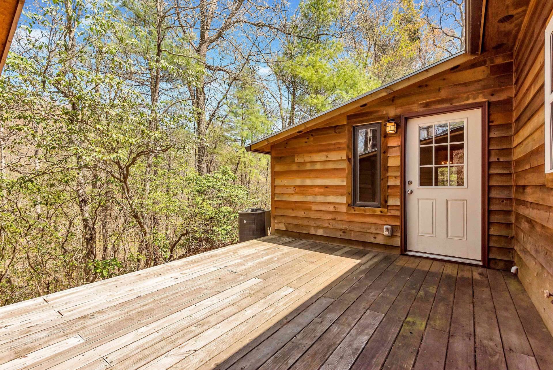 The back deck offers privacy for a grill or a hot tub area.