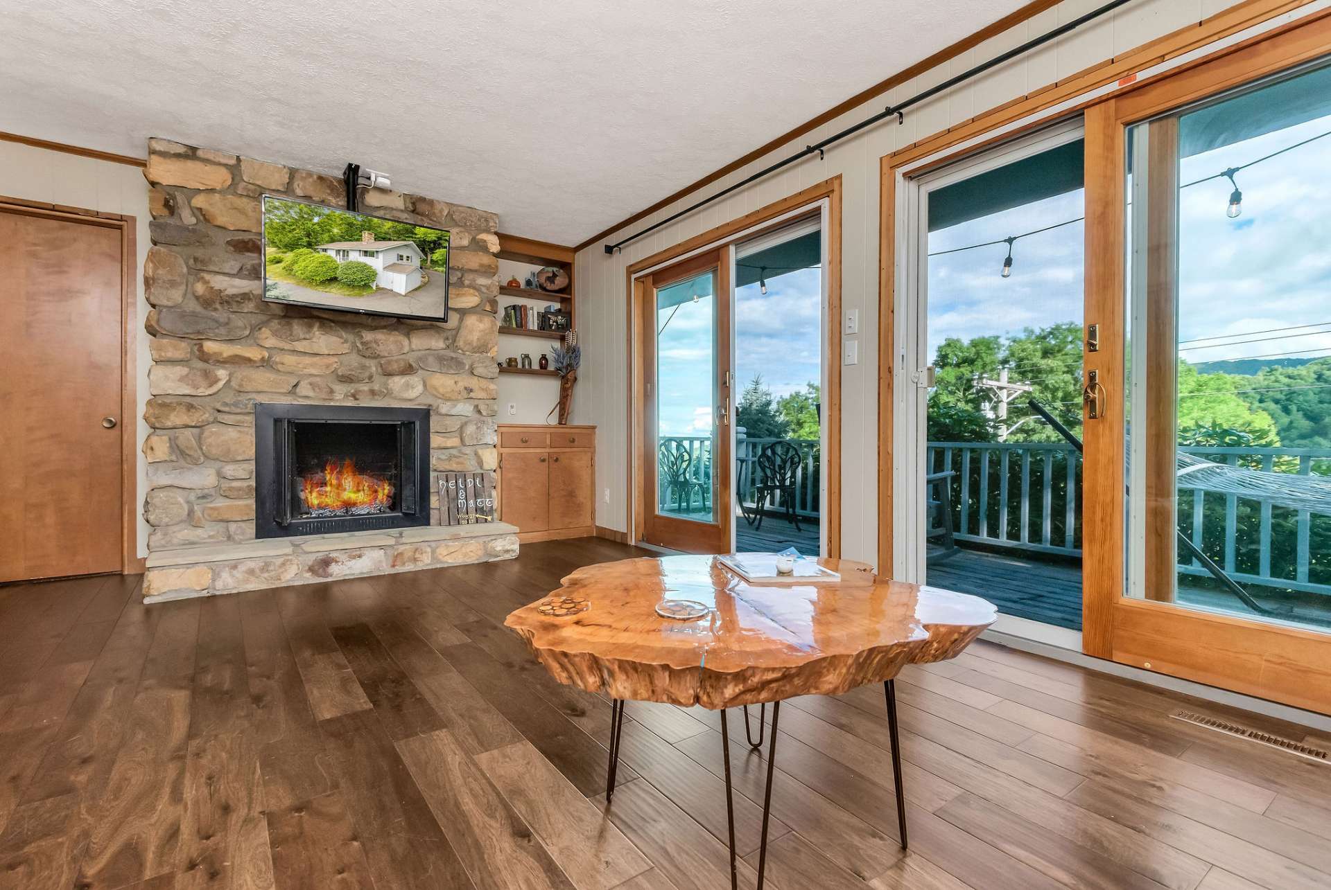 Living area offers lots of windows for natural light and a fireplace for those cool winter evenings.