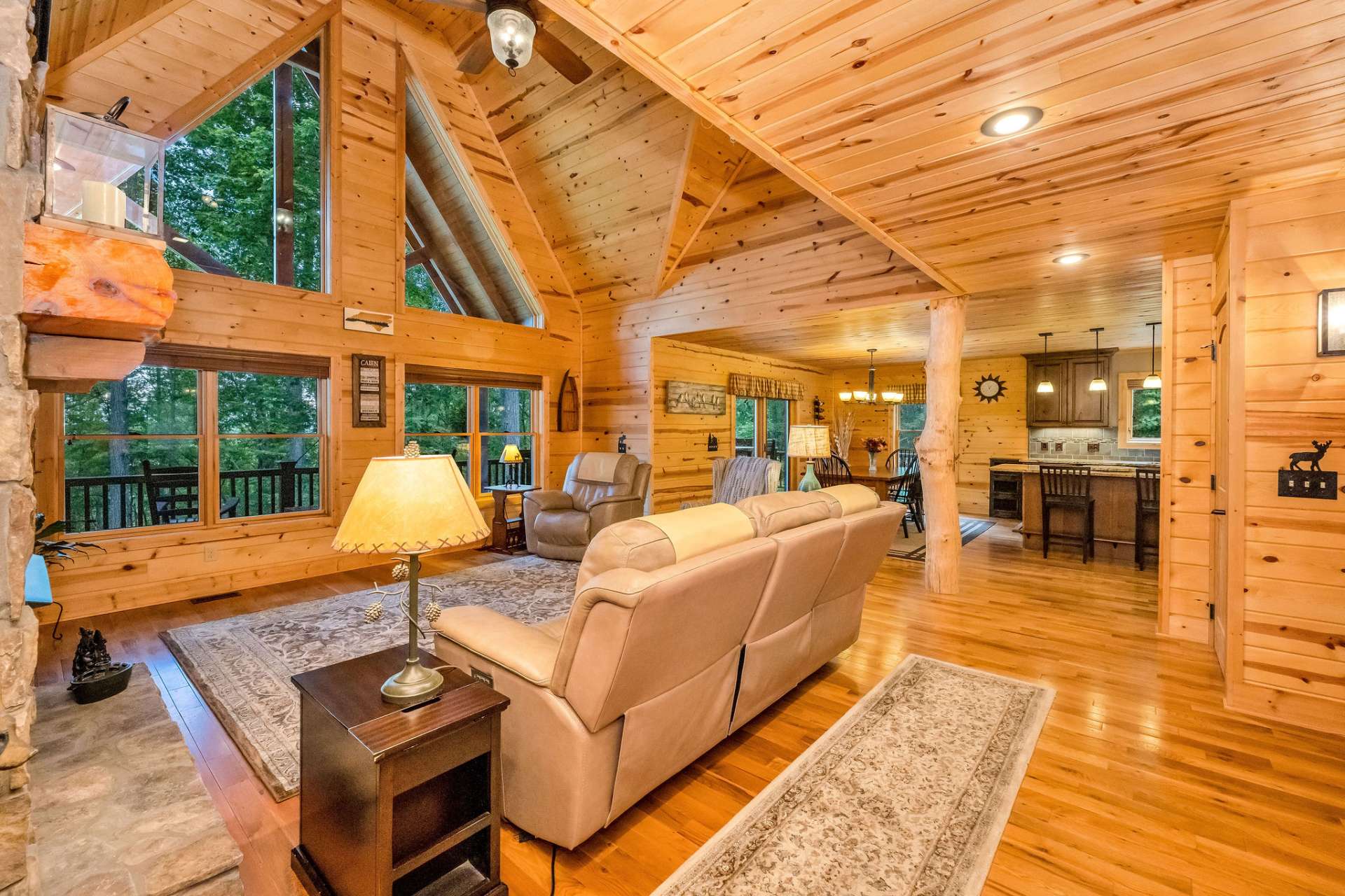 The great room seamlessly blends the living, dining, and kitchen areas, creating an open, connected space perfect for mountain living.