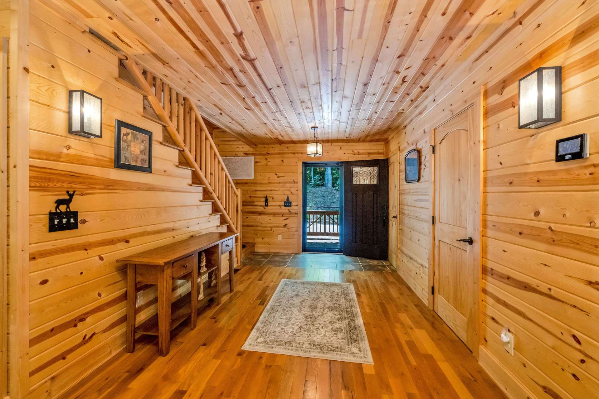 The foyer welcomes you with a coat closet and a main-level half bath.