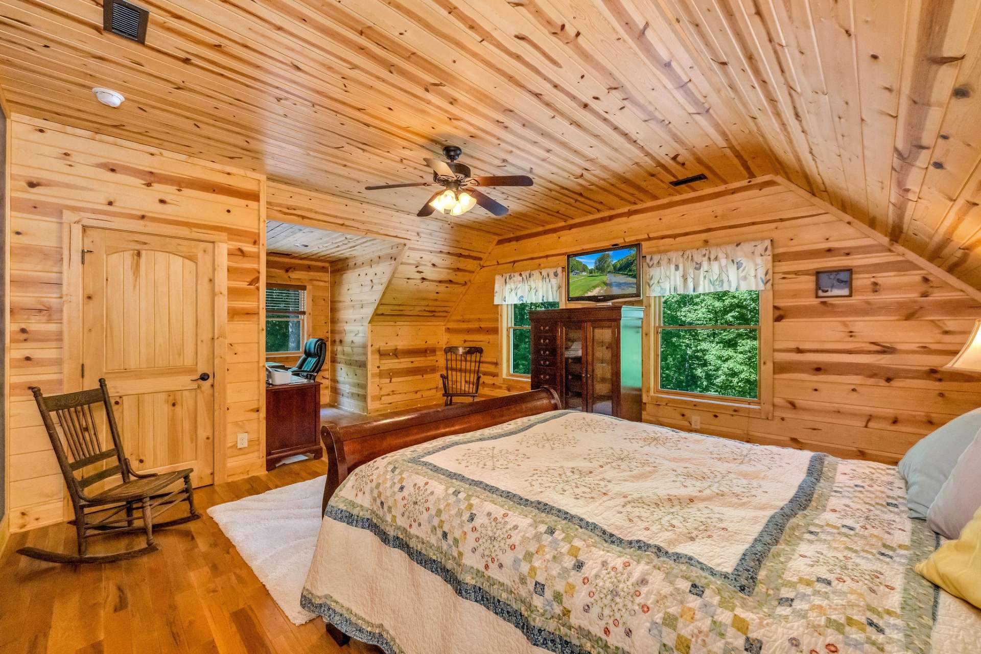 The second spacious guest room with a walk-in closet and thoughtful built-in drawers.