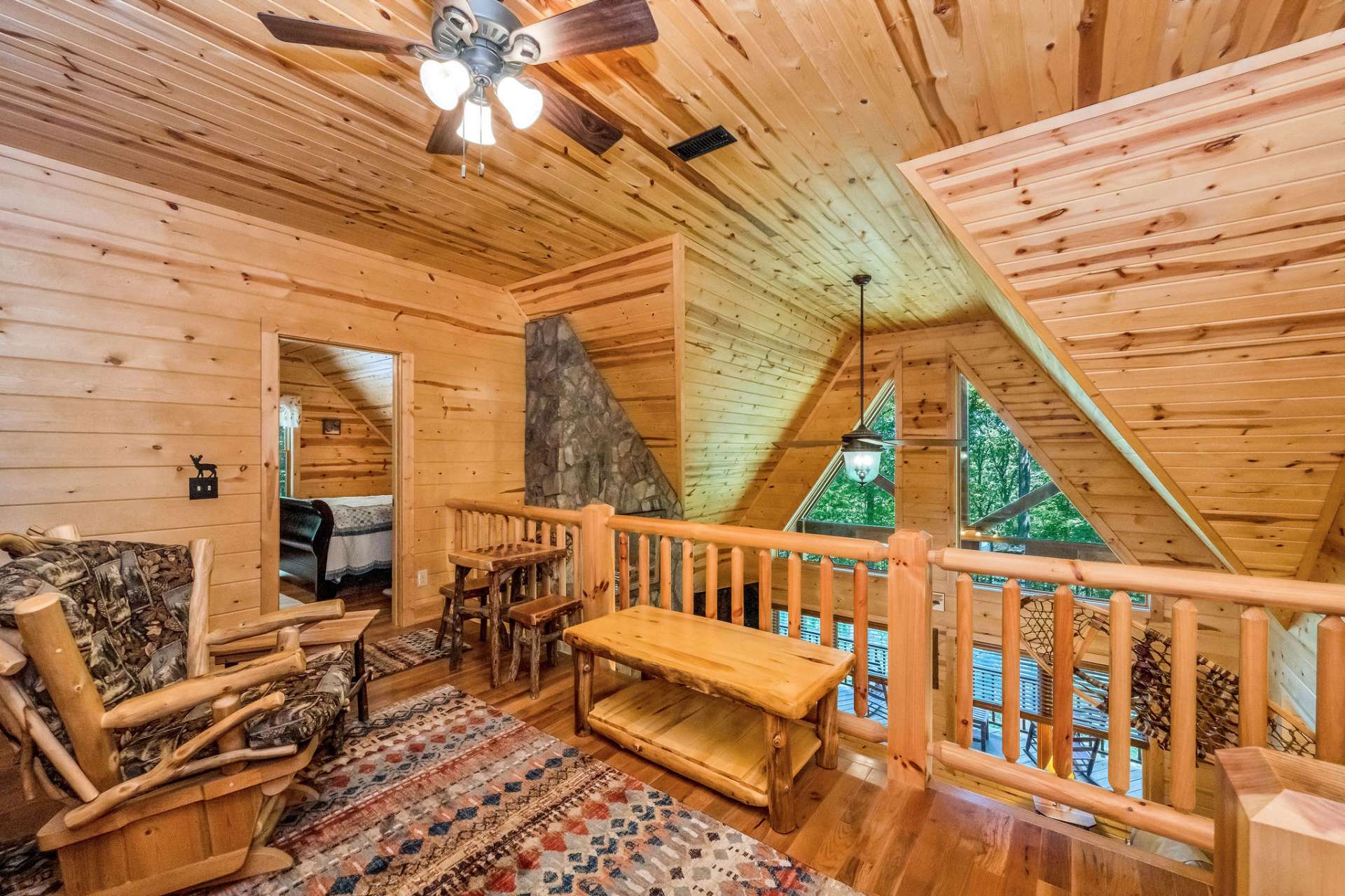The open loft offers a flexible sitting area, ideal for relaxing, working, or unwinding with a good book.