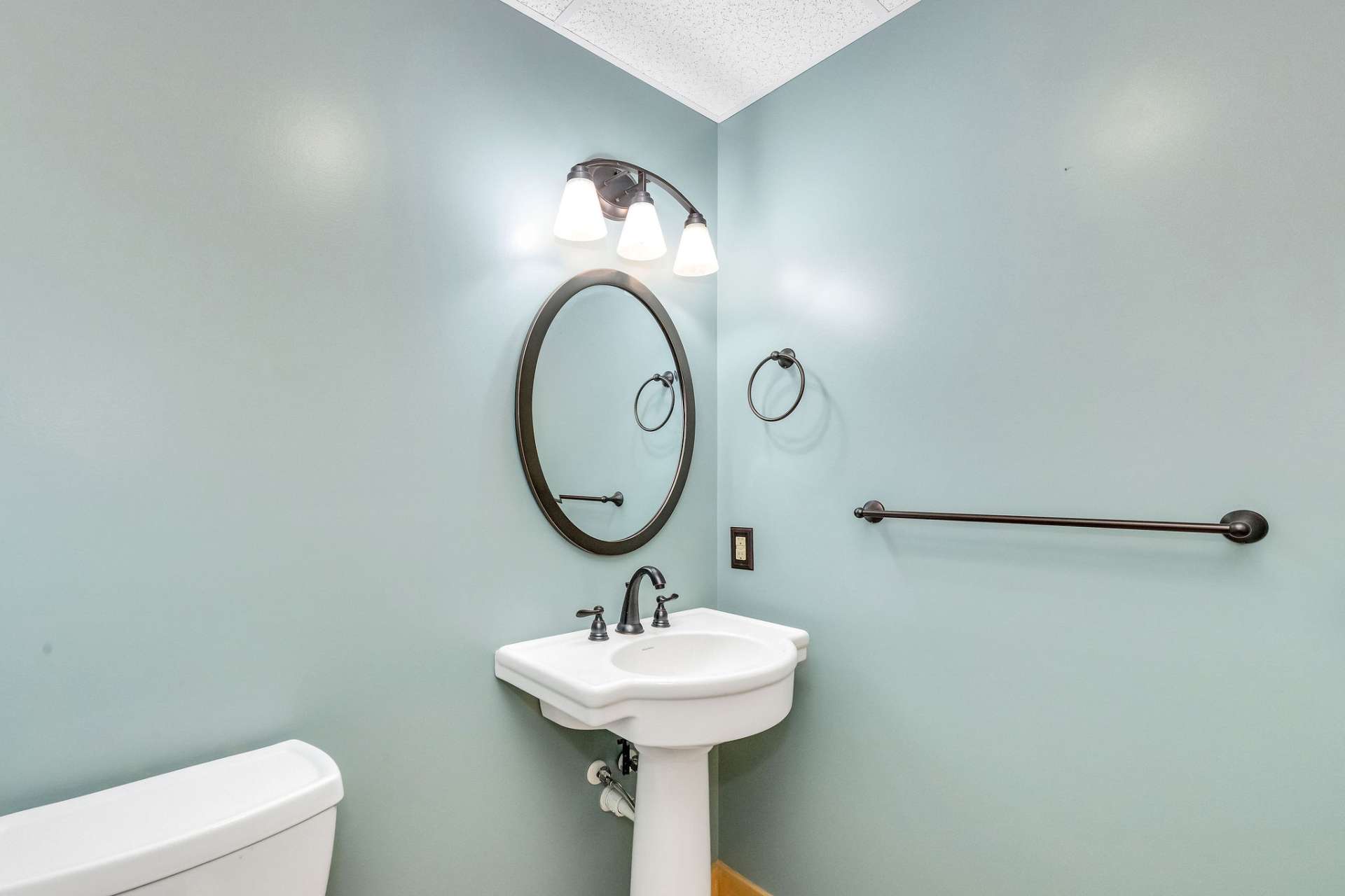 The lower level includes a second half bath, adding comfort and convenience to this living space.