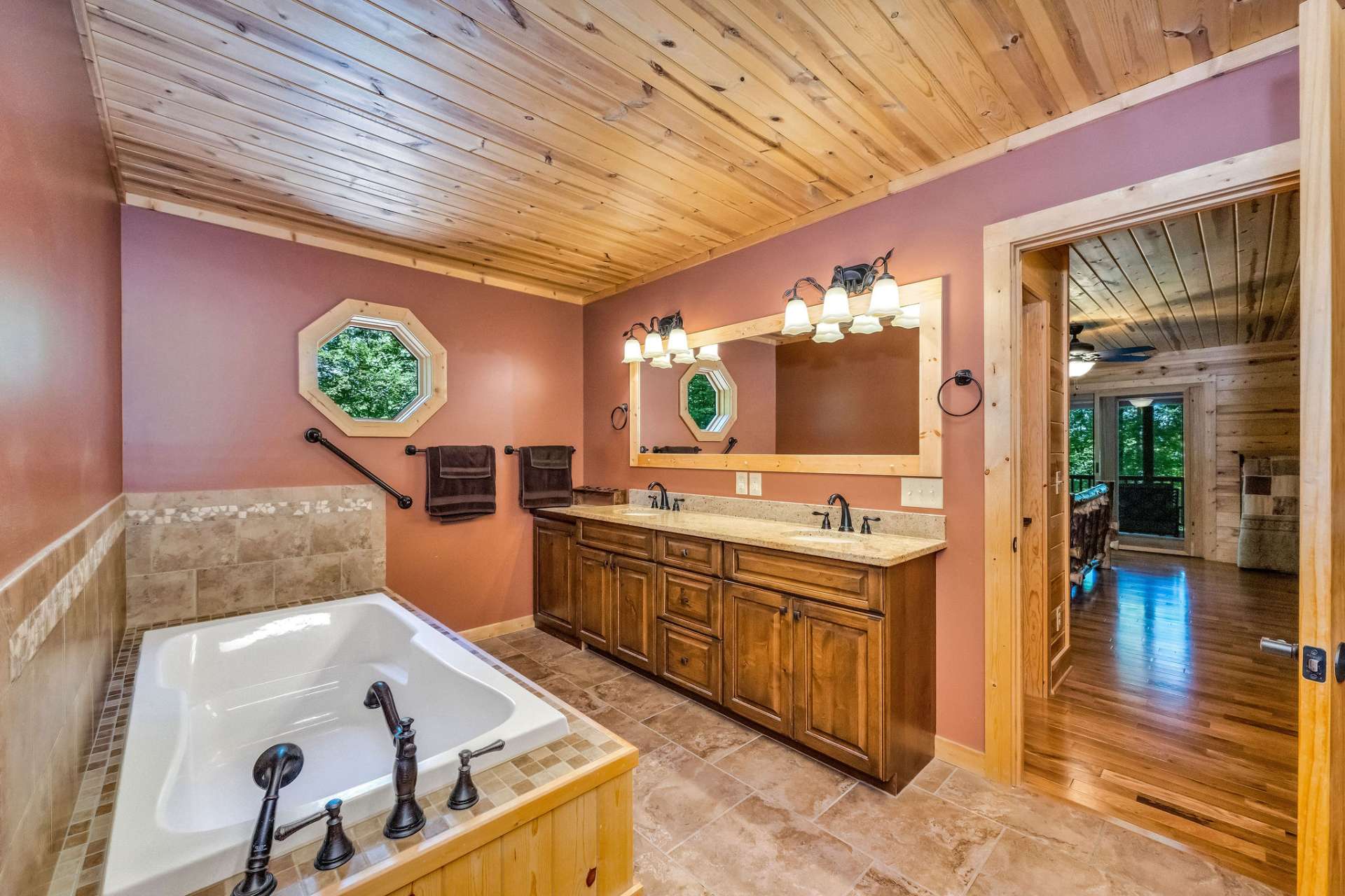 Featuring a soaking tub and double sinks.