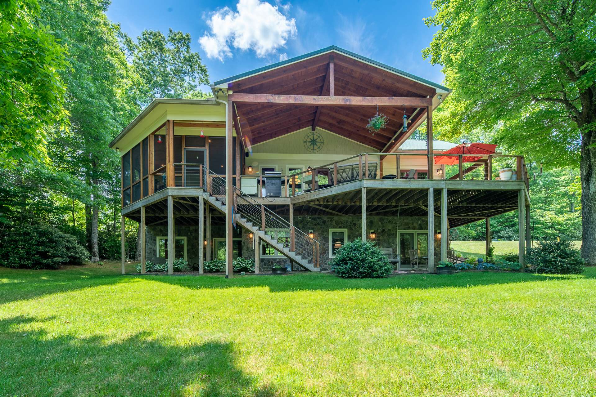 Wrap-around porch features both covered and uncovered portions so you can enjoy the fresh mountain air and beautiful views rain or shine.