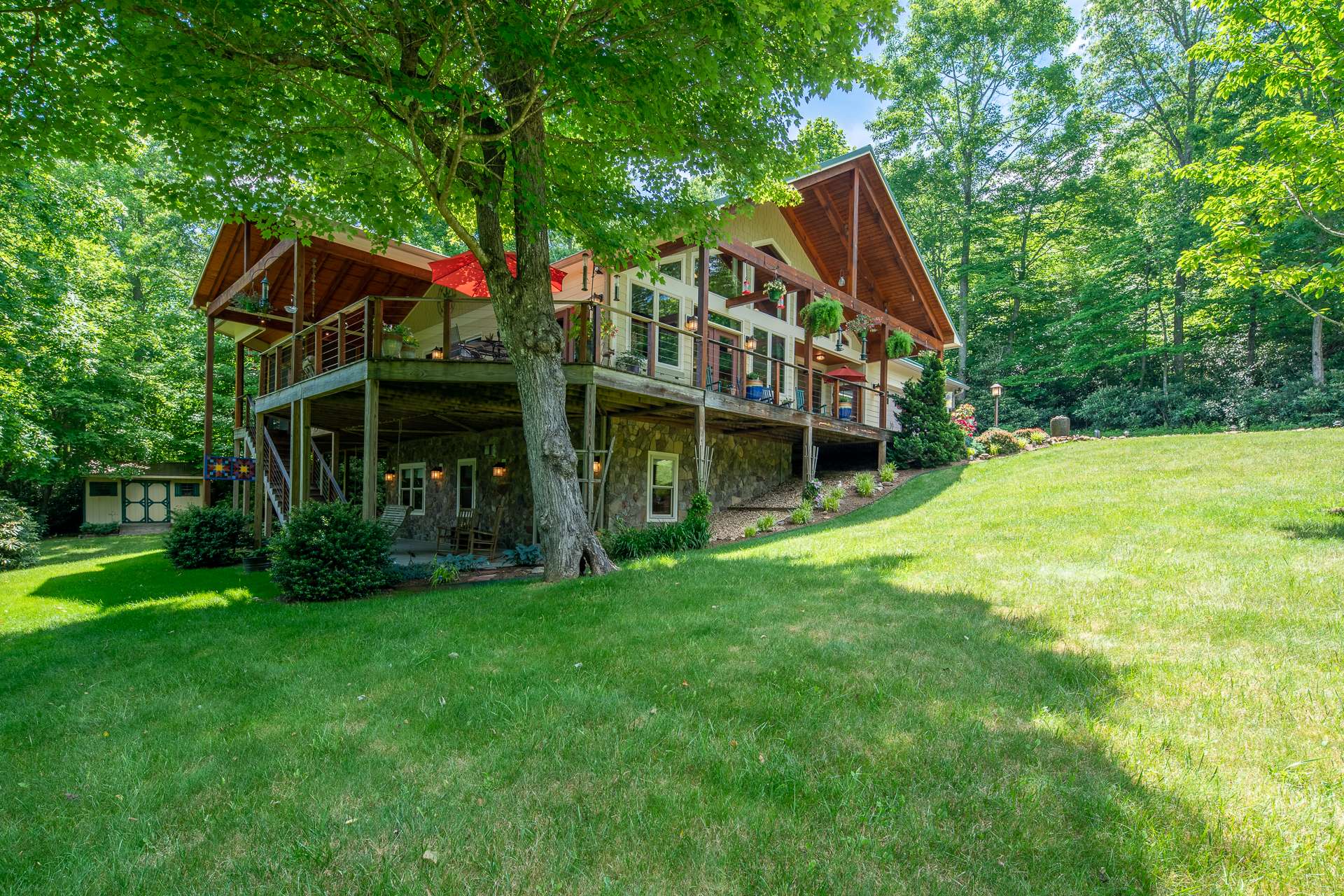 A spacious lower level patio provides a shady area to relax on a hot summer day and would give your overnight guests their own outdoor space.