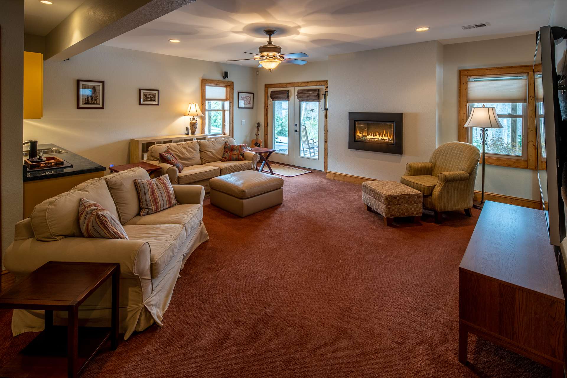 Cozy direct vent wall fireplace and access to patio area.