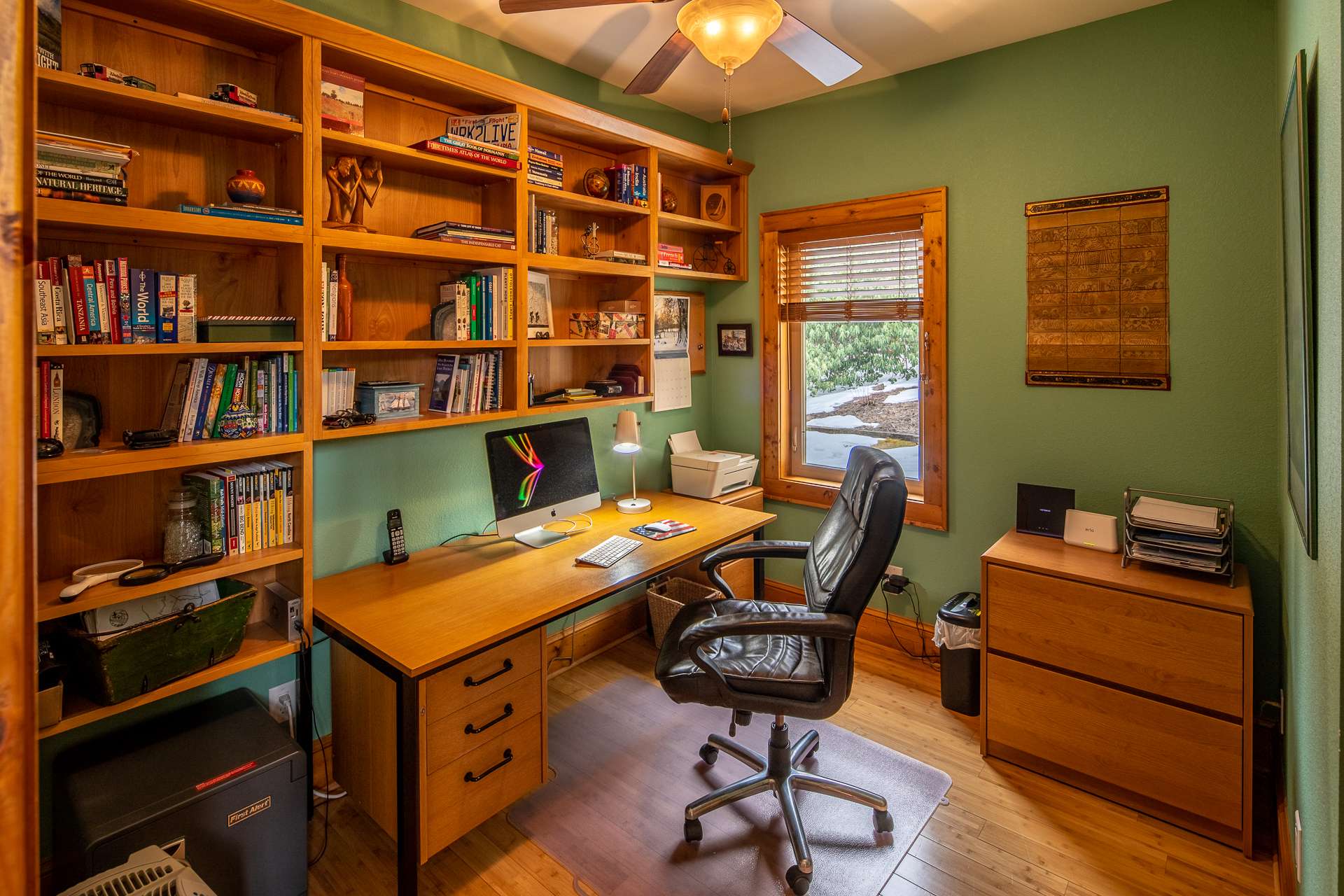 Office provides space for your furniture as well as a wall of built-in shelves.  Suitable for home office, study or small library.