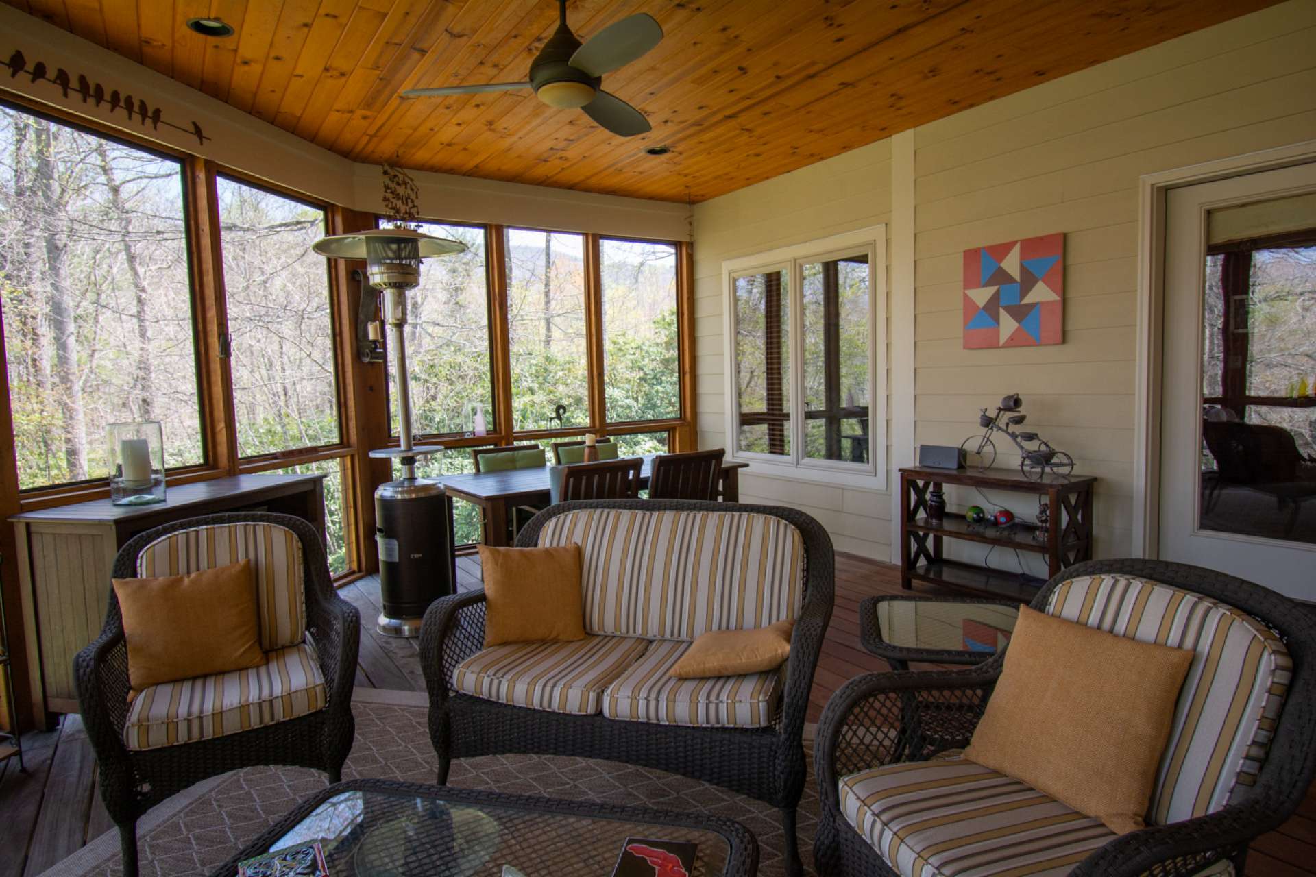 Three seasons of the year, this screened porch is a nice expansion to both indoor living space and outdoor living space during inclement weather.