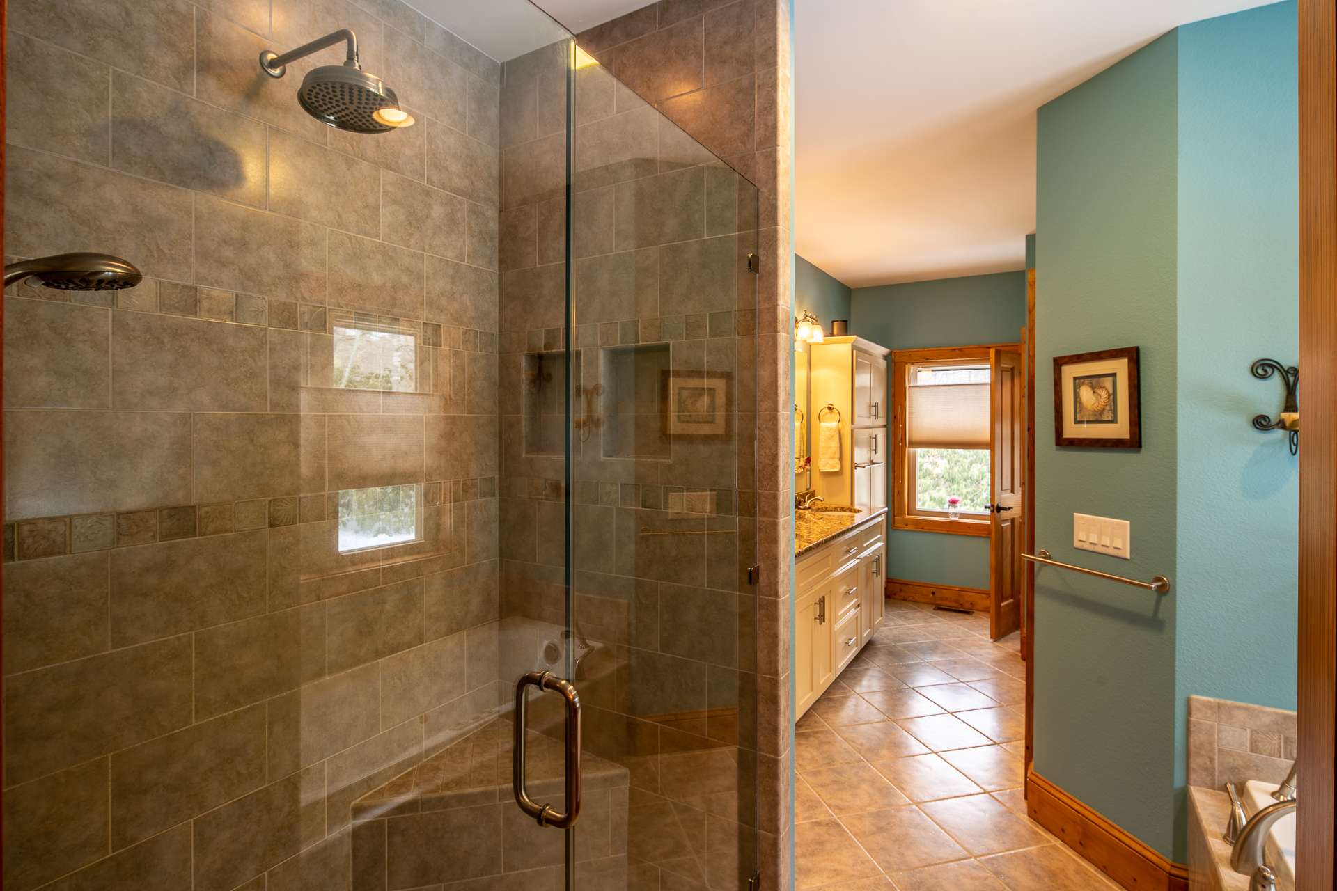 Large walk-in tile shower and…