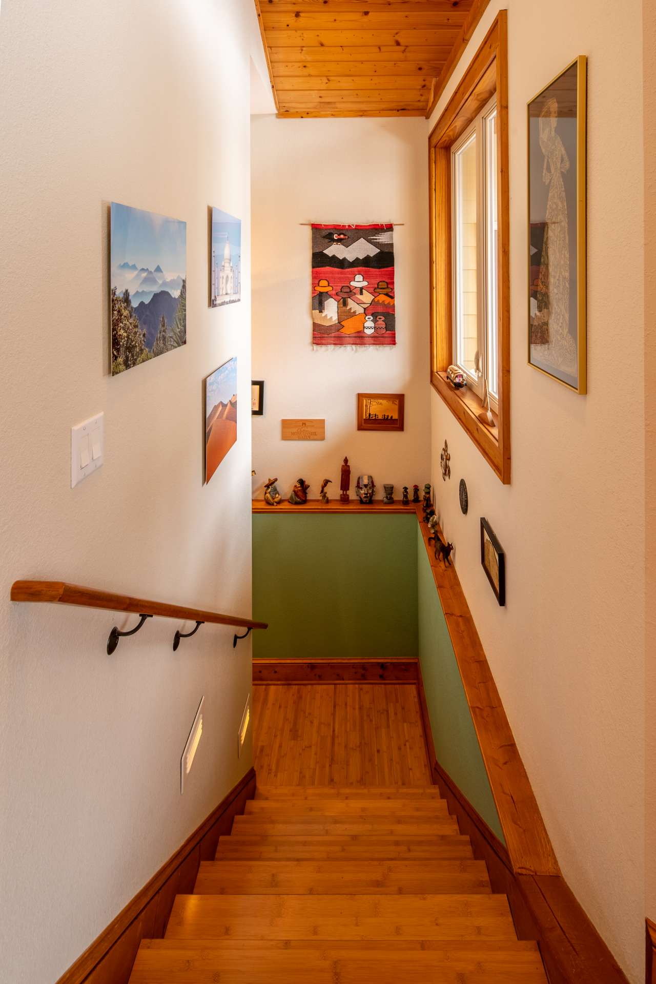 Stairway leading to additional living space in lower level.