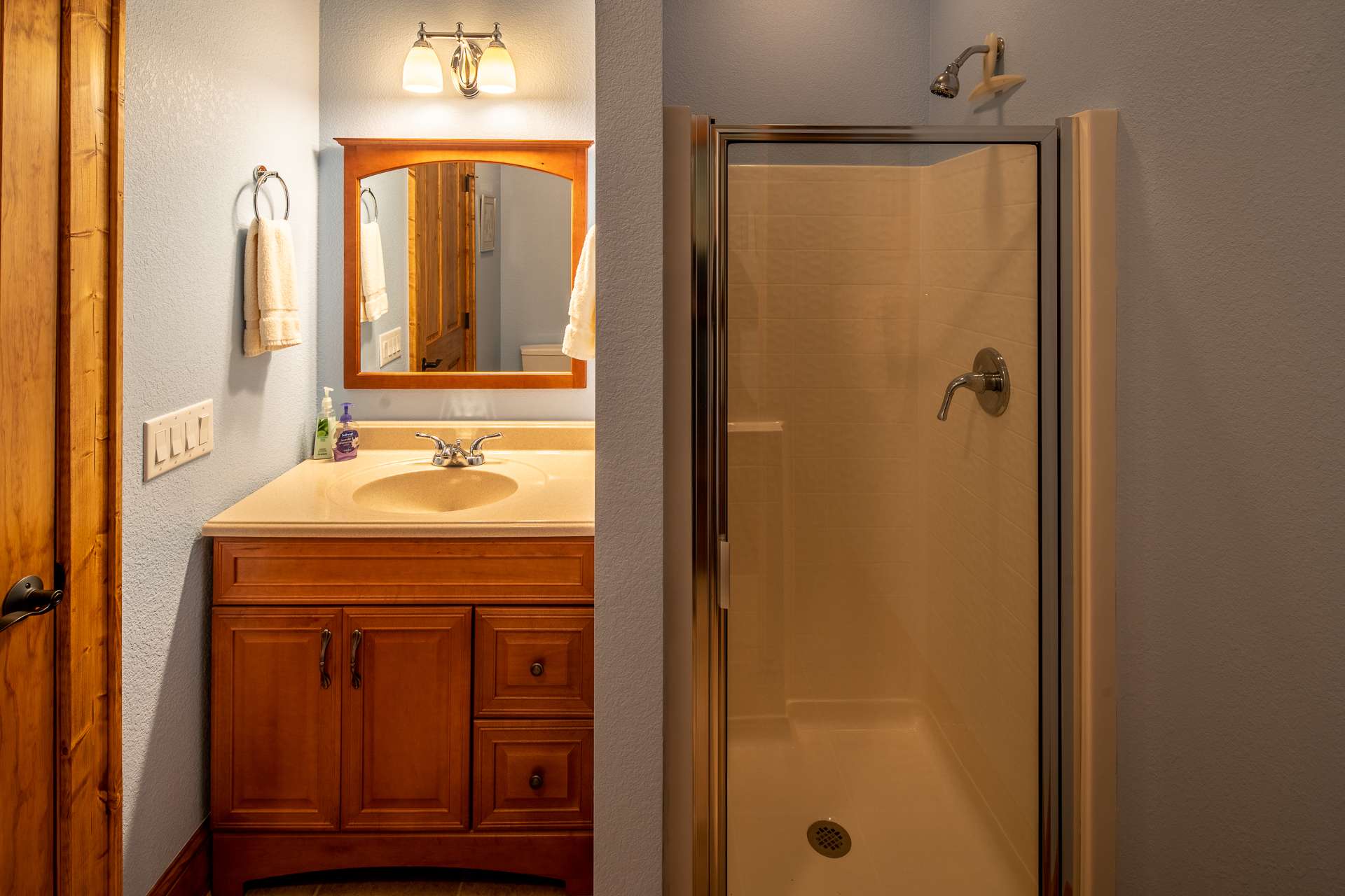 The bath serving this bedroom also serves as the bath for guests and can be accessed from either the bedroom or the game area.  It also features a heated tile floor.