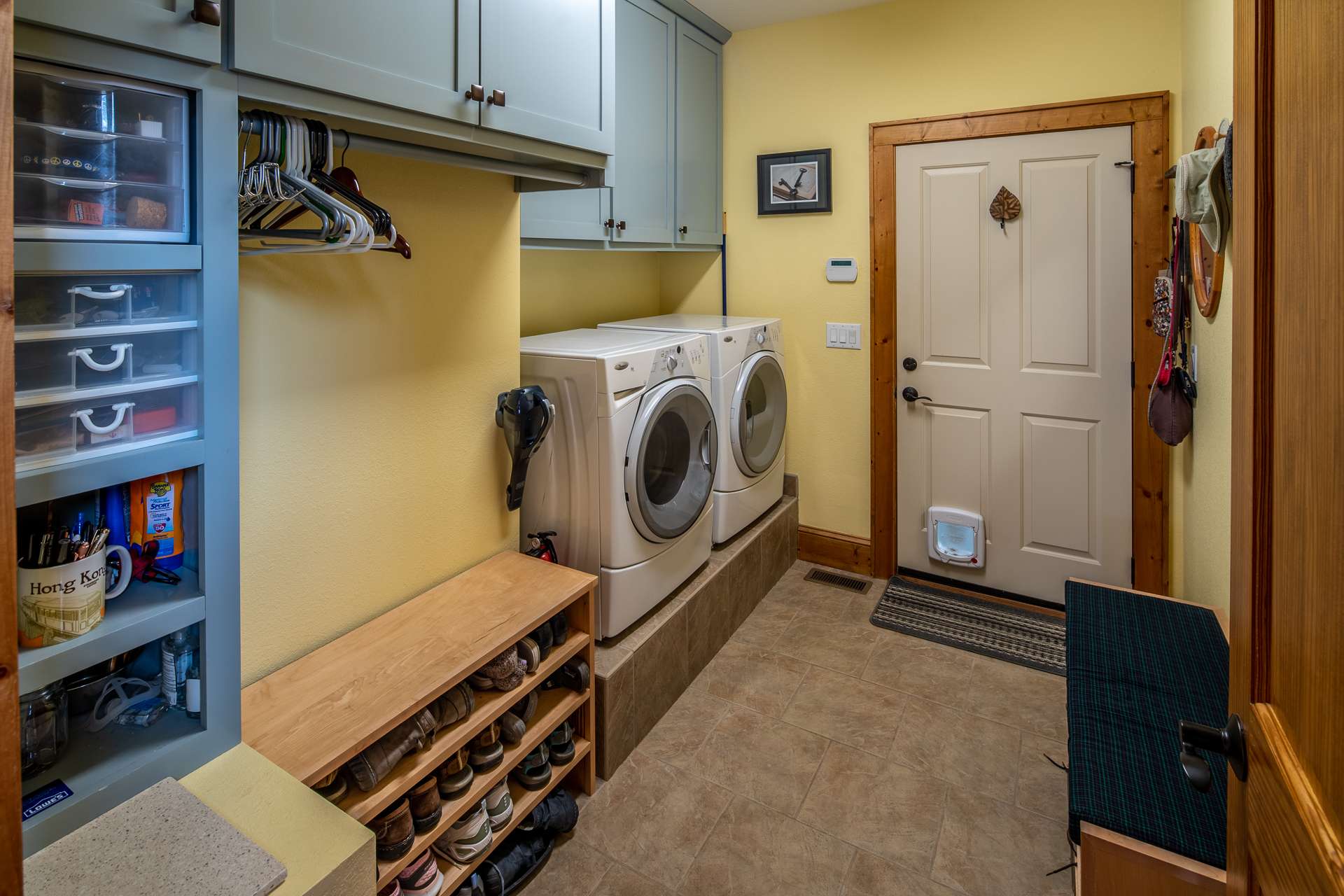 Laundry room also serves as mudroom between garage and great room.  Plenty of storage space with built-ins.