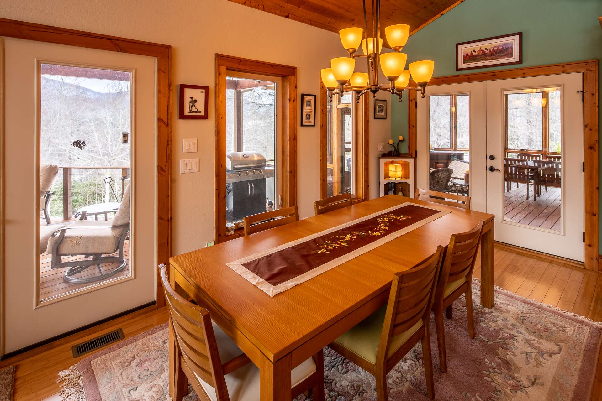 Dining area easily expands onto both screened porch and open deck if you prefer al fresco dining.