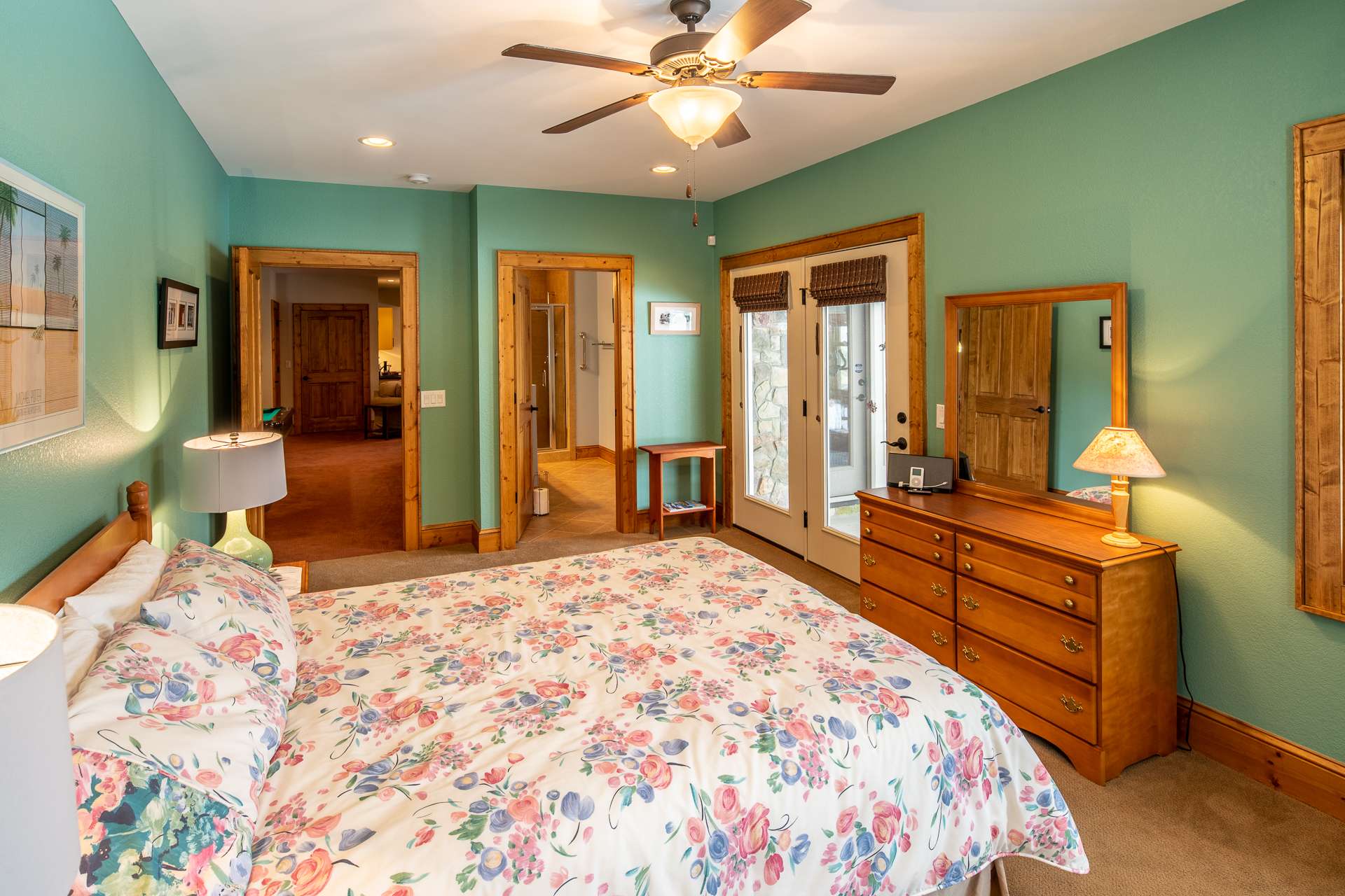 This spacious bedroom offers a private bath and access to the patio.