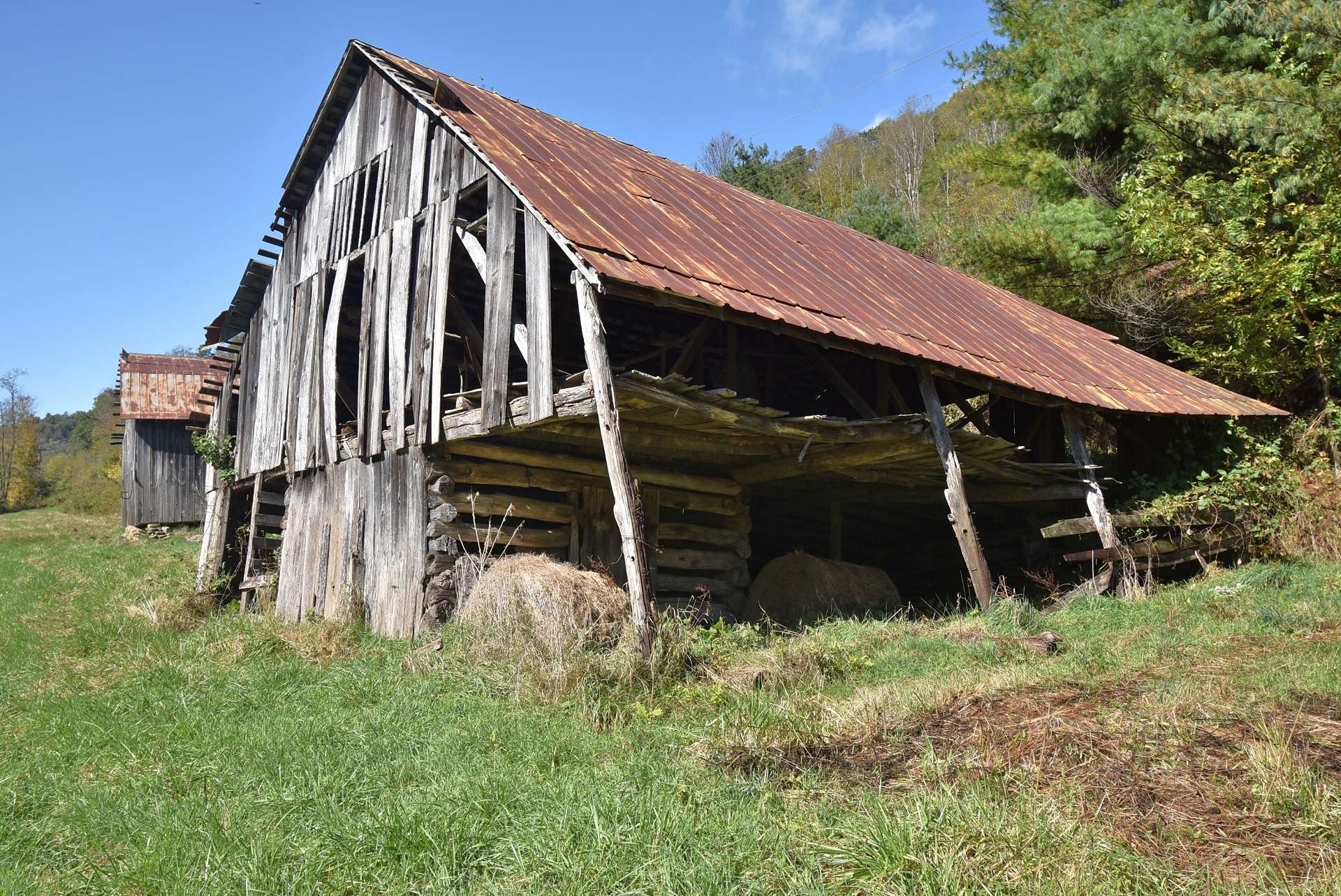 This farmstead barn shows off its vintage log beginnings.