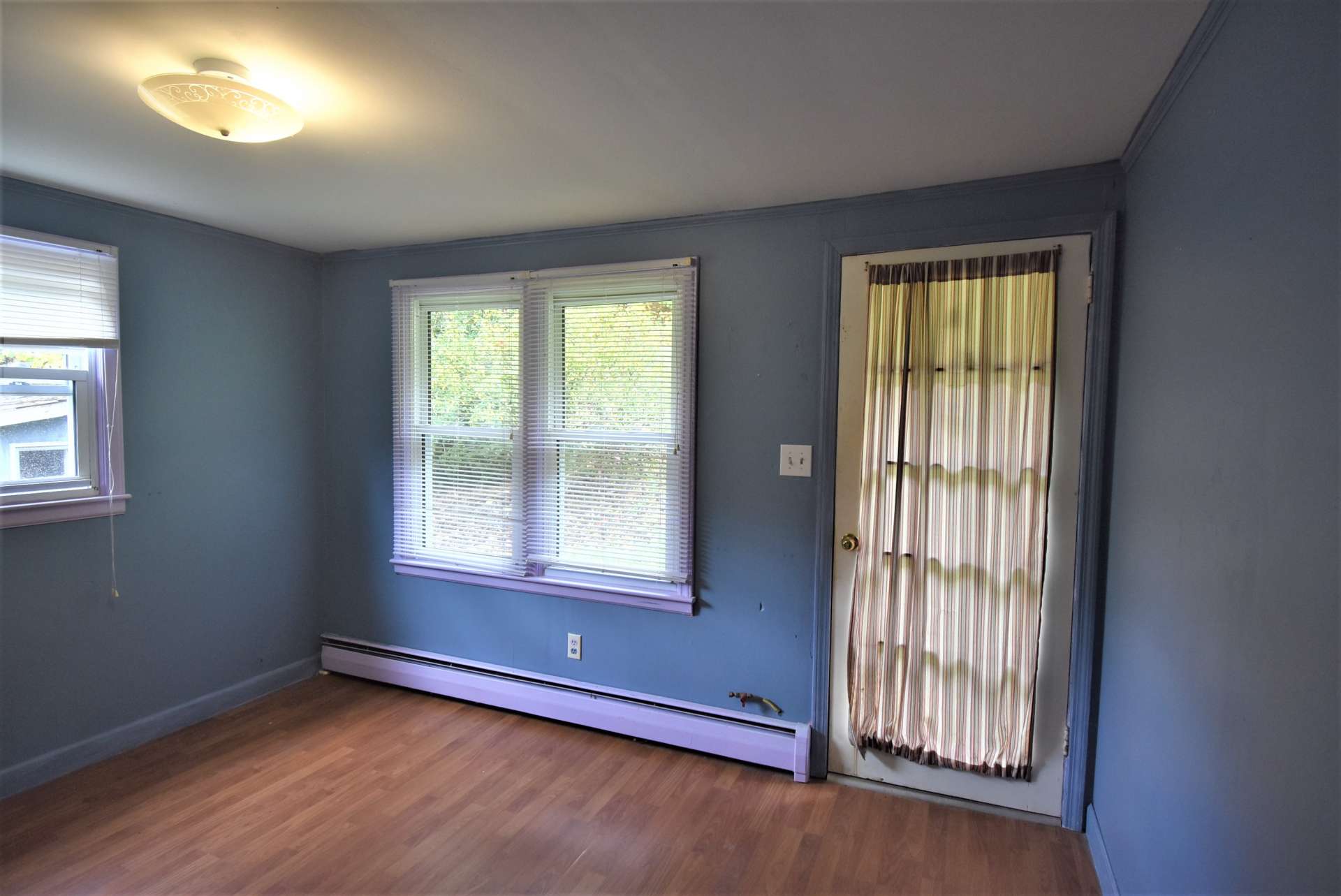 This bedroom offers private access to the outdoors.